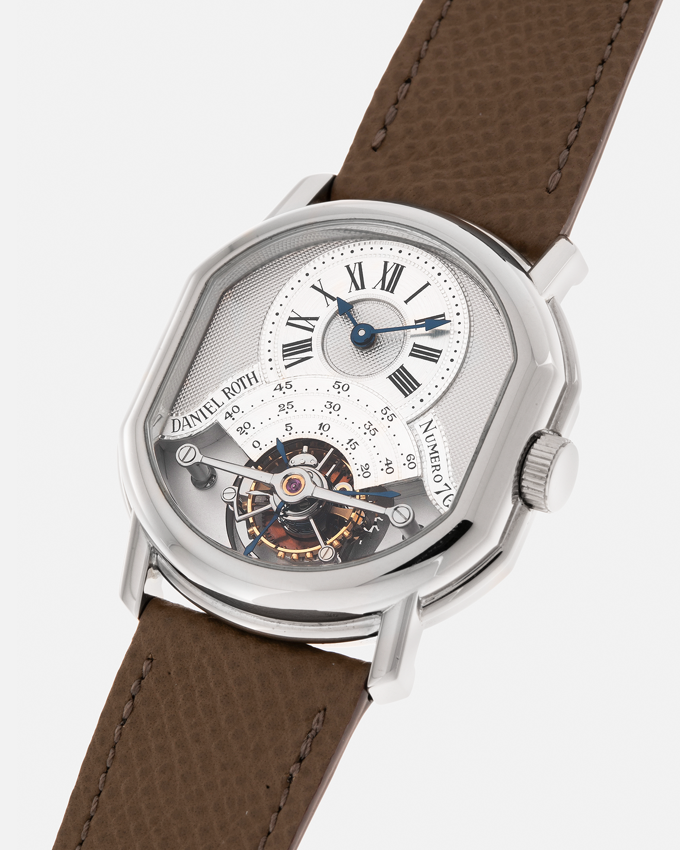 Brand: Daniel Roth
Year: Early 1990’s
Model: 2187 Régulateur Tourbillon Clou De Paris Guilloché (First Generation)
Material: 18-carat White Gold
Movement: Daniel Roth Cal. DR 307 One-Minute Tourbillon (Based on Lemania Cal. 387 Ébauche), Manual-Winding
Case Dimensions: 35mm x 38mm (Lug-to-Lug 41mm)
Lug Width: 20mm
Strap: Nostime Taupe Brown Textured Calf Leather Strap