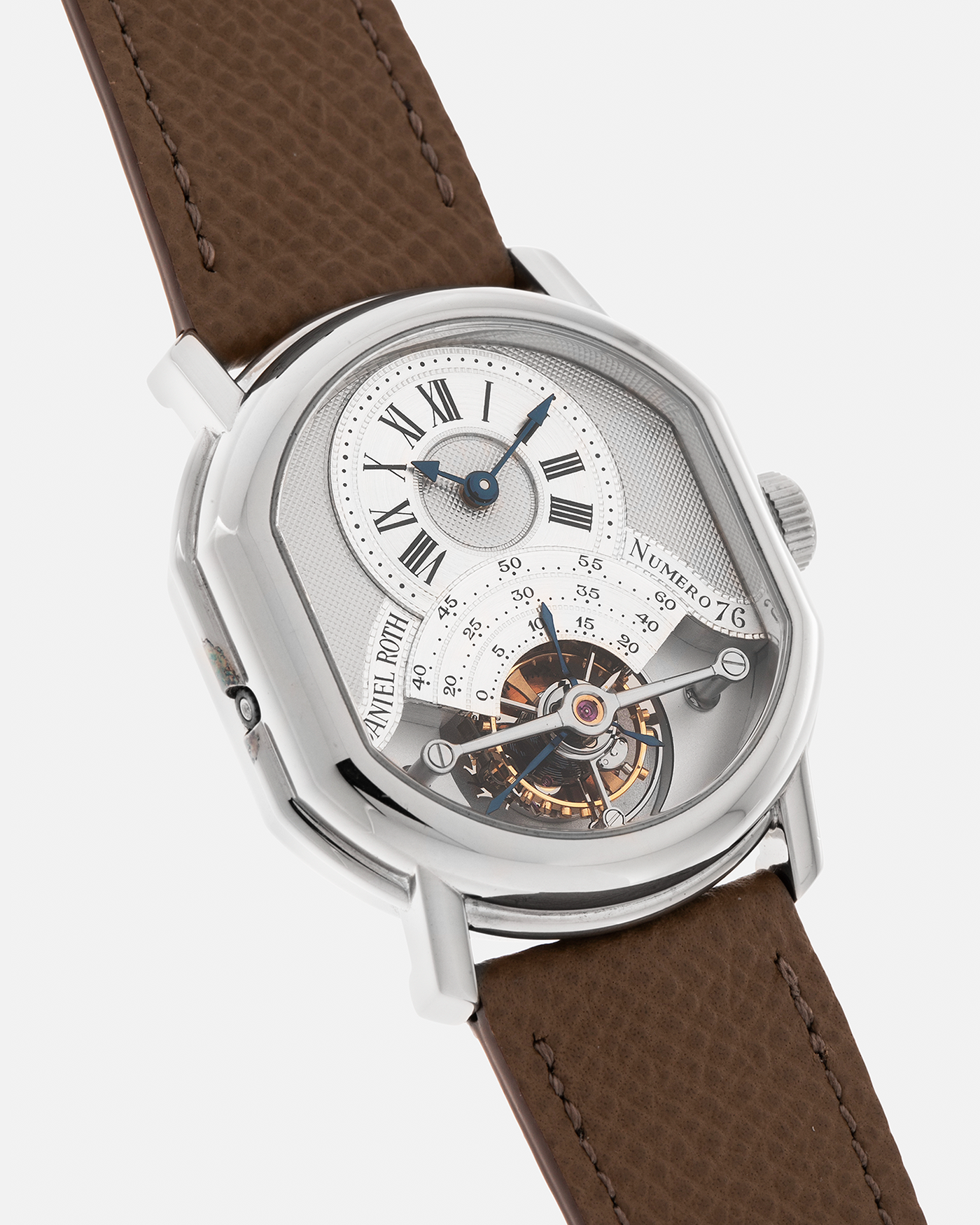 Brand: Daniel Roth
Year: Early 1990’s
Model: 2187 Régulateur Tourbillon Clou De Paris Guilloché (First Generation)
Material: 18-carat White Gold
Movement: Daniel Roth Cal. DR 307 One-Minute Tourbillon (Based on Lemania Cal. 387 Ébauche), Manual-Winding
Case Dimensions: 35mm x 38mm (Lug-to-Lug 41mm)
Lug Width: 20mm
Strap: Nostime Taupe Brown Textured Calf Leather Strap