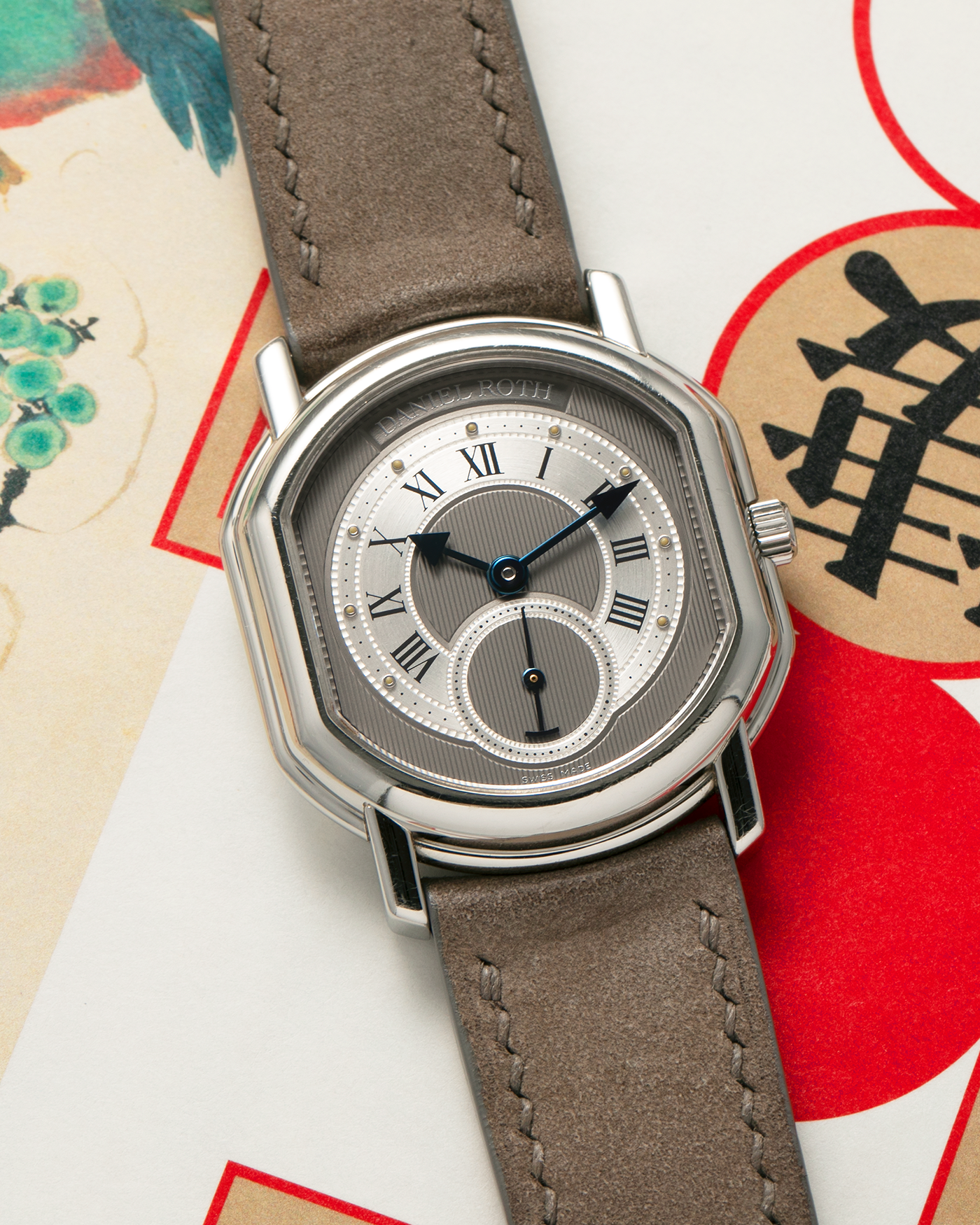 Brand: Daniel Roth
Year: 1990’s
Model: Seconds at Six
Material: Stainless Steel
Movement: Daniel Roth Cal. DR111 (Girard Perregaux-based), Self-Winding
Case Dimensions: 35mm x 32mm (Lug-to-Lug 41mm)
Lug Width: 20mm
Strap: Strapology Taupe Calf Leather Strap with Signed Stainless Steel Tang Buckle