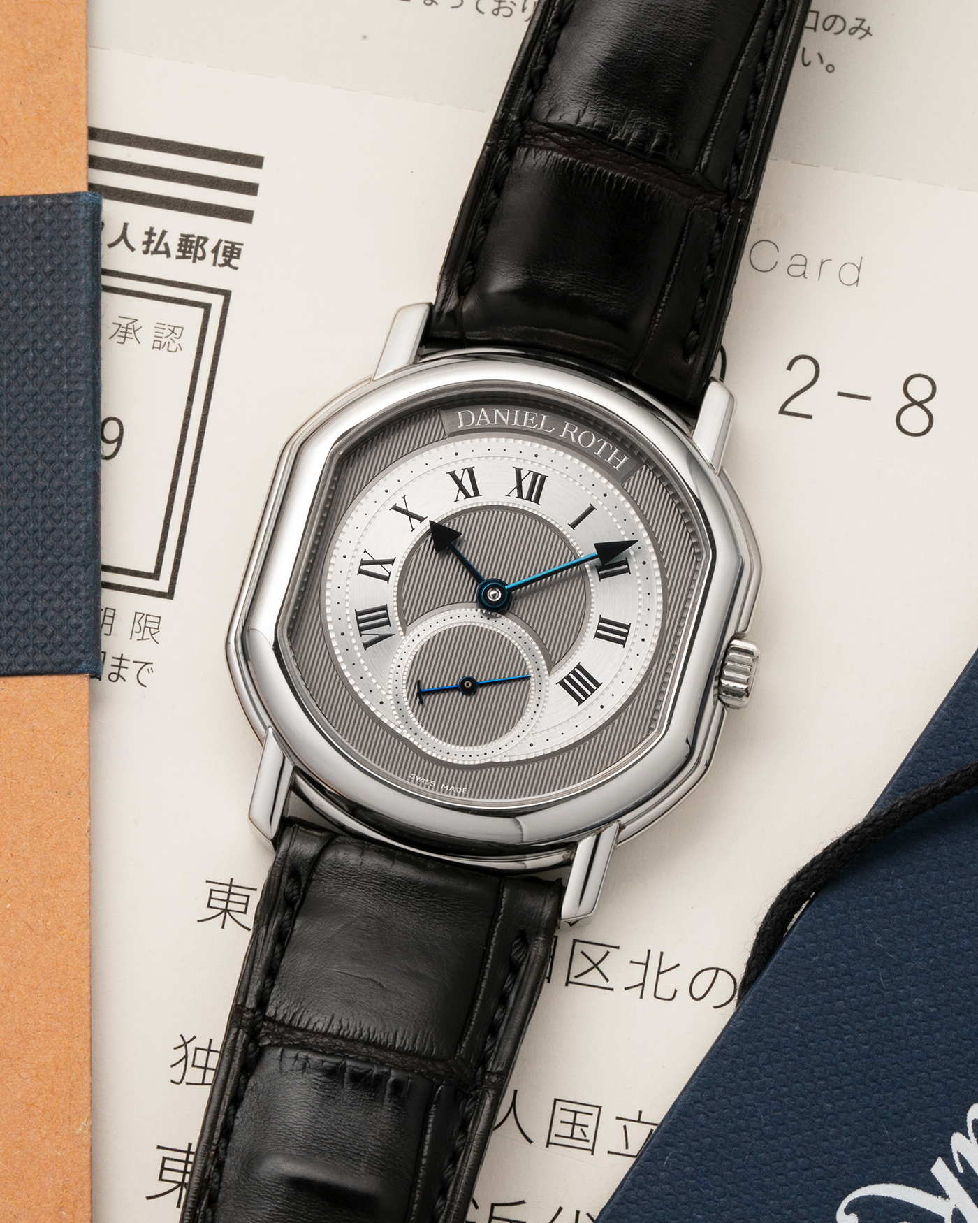 Brand: Daniel Roth
Year: 1990’s
Model: Seconds at Six
Reference: 207
Material: Stainless Steel
Movement: Daniel Roth Cal. DR111 (Girard-Perregaux based), Self-Winding
Case Dimensions: 35mm x 38mm (Lug-to-Lug 41mm)
Lug Width: 20mm
Strap: Daniel Roth Black Alligator Leather Strap with Signed Stainless Steel Deployant Clasp