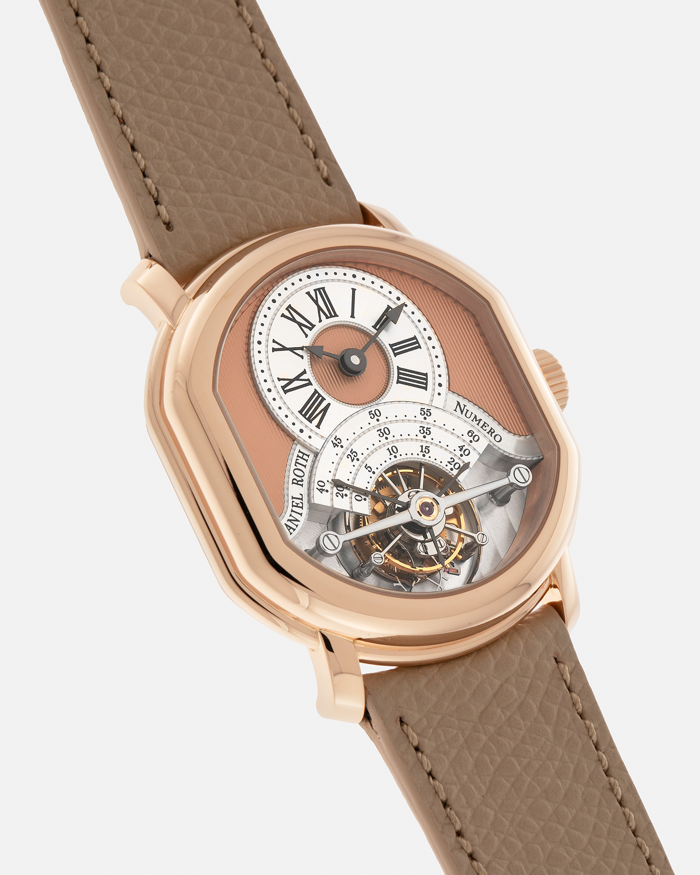 Brand: Daniel Roth
Year: 2025
Model: Tourbillon Rose Gold
Material: 18-carat Rose Gold, 925 Sterling Silver
Movement: Daniel Roth Cal. DR001, Manual-Winding
Case Dimensions: 35.5mm x 38.6mm x 9.2mm (Lug-to-Lug 42mm)
Lug Width: 20mm
Strap: Daniel Roth Taupe Calfskin Leather Strap with Signed 18-carat Rose Gold Tang Buckle