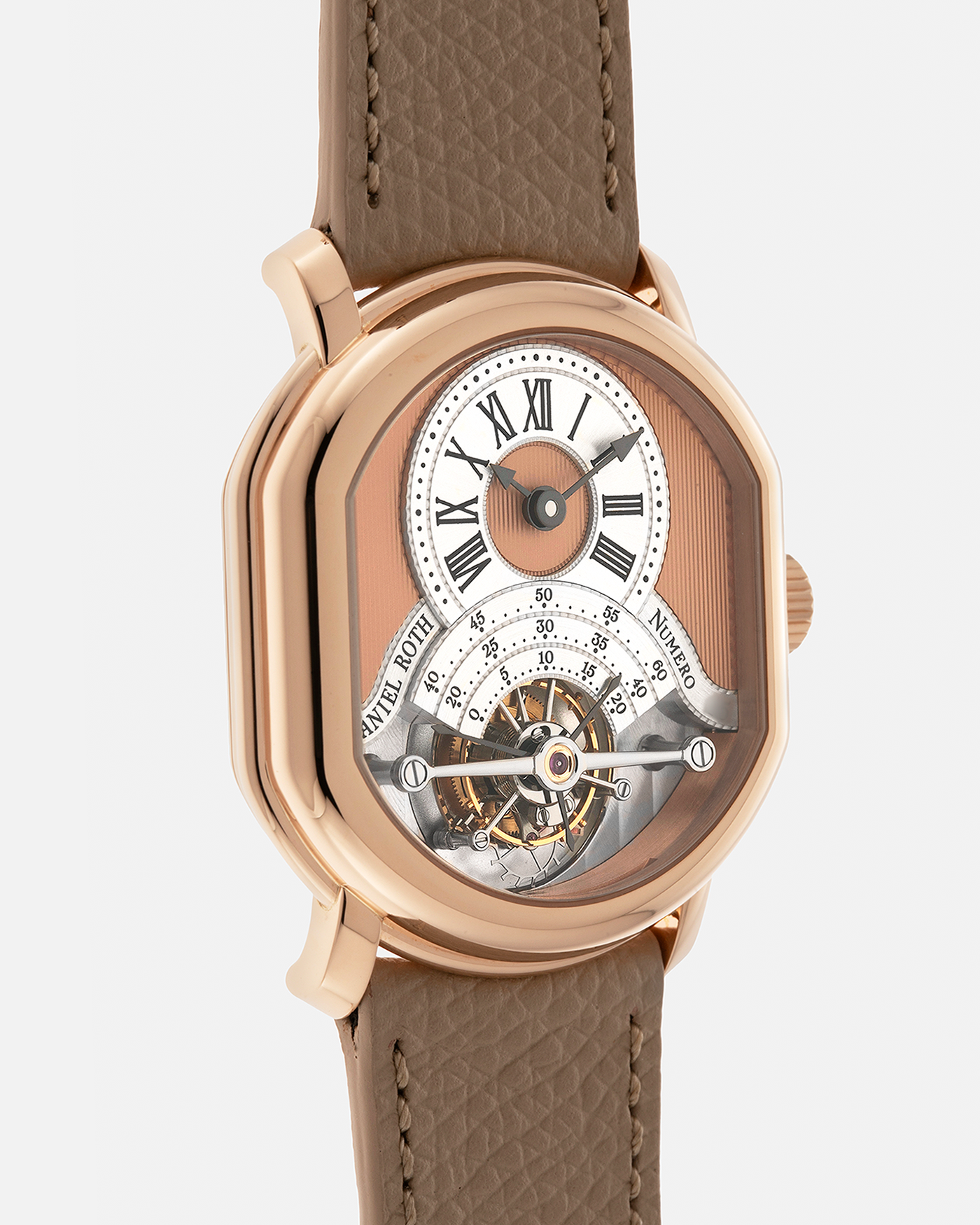 Brand: Daniel Roth
Year: 2025
Model: Tourbillon Rose Gold
Material: 18-carat Rose Gold, 925 Sterling Silver
Movement: Daniel Roth Cal. DR001, Manual-Winding
Case Dimensions: 35.5mm x 38.6mm x 9.2mm (Lug-to-Lug 42mm)
Lug Width: 20mm
Strap: Daniel Roth Taupe Calfskin Leather Strap with Signed 18-carat Rose Gold Tang Buckle