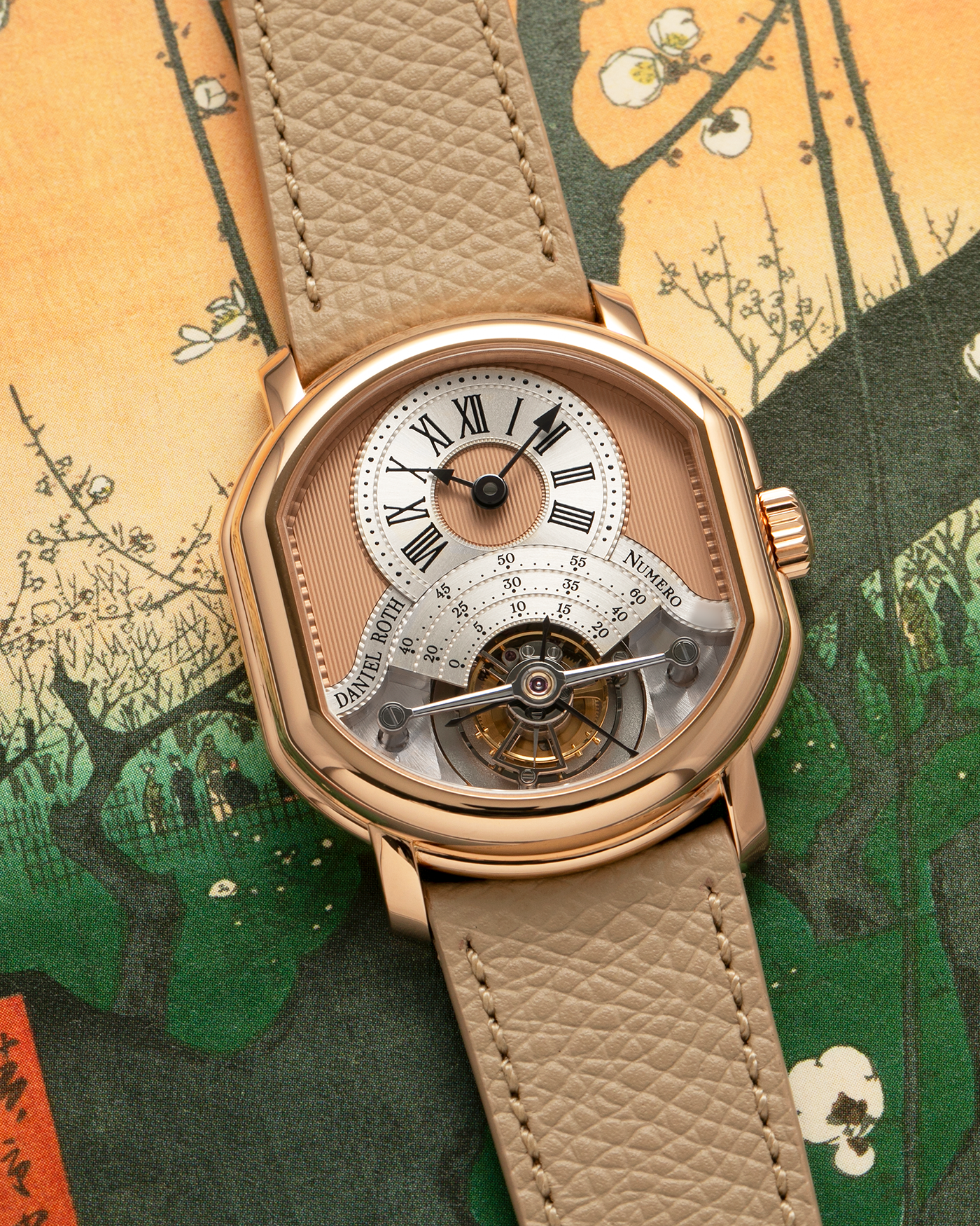 Brand: Daniel Roth
Year: 2025
Model: Tourbillon Rose Gold
Material: 18-carat Rose Gold, 925 Sterling Silver
Movement: Daniel Roth Cal. DR001, Manual-Winding
Case Dimensions: 35.5mm x 38.6mm x 9.2mm (Lug-to-Lug 42mm)
Lug Width: 20mm
Strap: Daniel Roth Taupe Calfskin Leather Strap with Signed 18-carat Rose Gold Tang Buckle