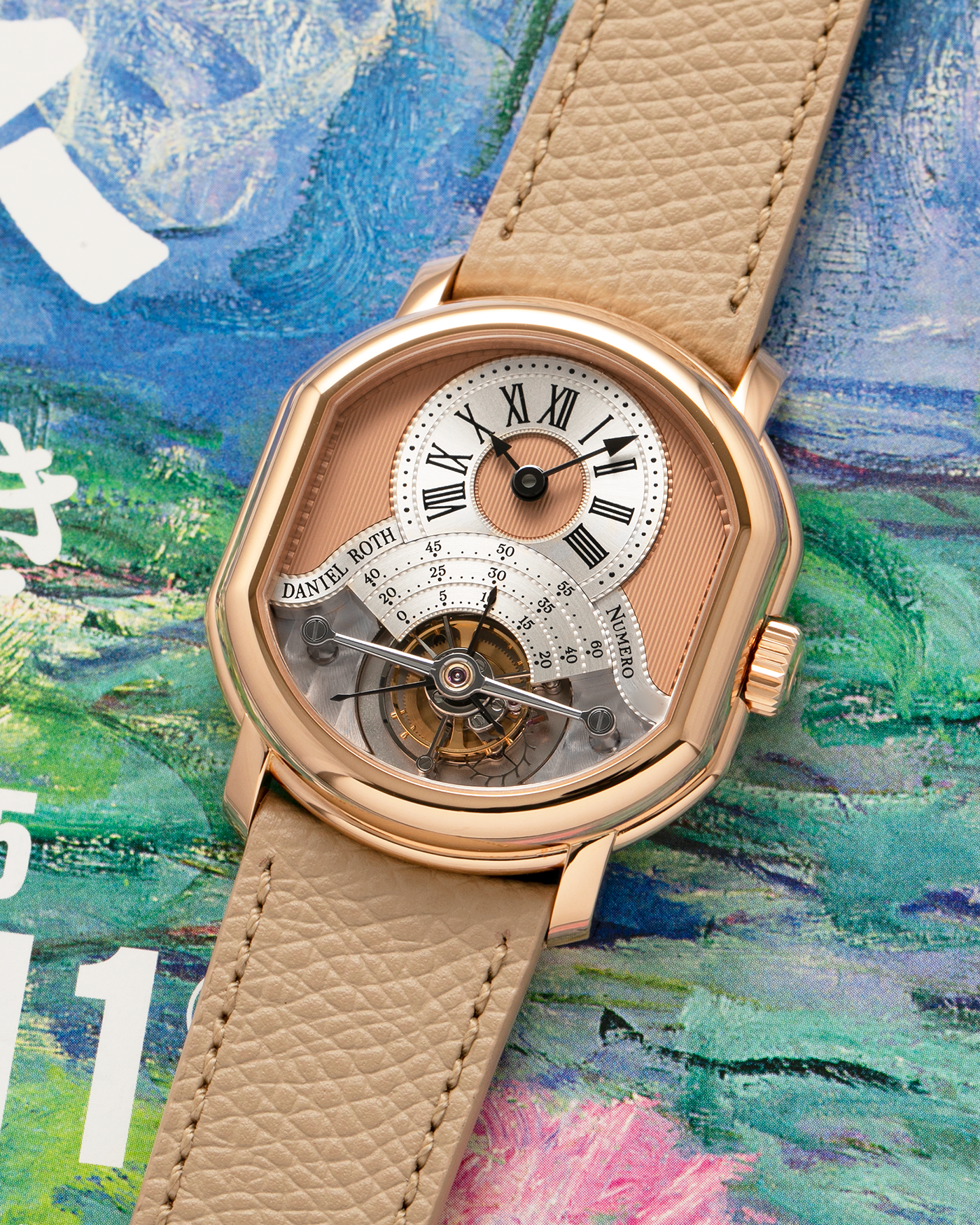 Brand: Daniel Roth
Year: 2025
Model: Tourbillon Rose Gold
Material: 18-carat Rose Gold, 925 Sterling Silver
Movement: Daniel Roth Cal. DR001, Manual-Winding
Case Dimensions: 35.5mm x 38.6mm x 9.2mm (Lug-to-Lug 42mm)
Lug Width: 20mm
Strap: Daniel Roth Taupe Calfskin Leather Strap with Signed 18-carat Rose Gold Tang Buckle