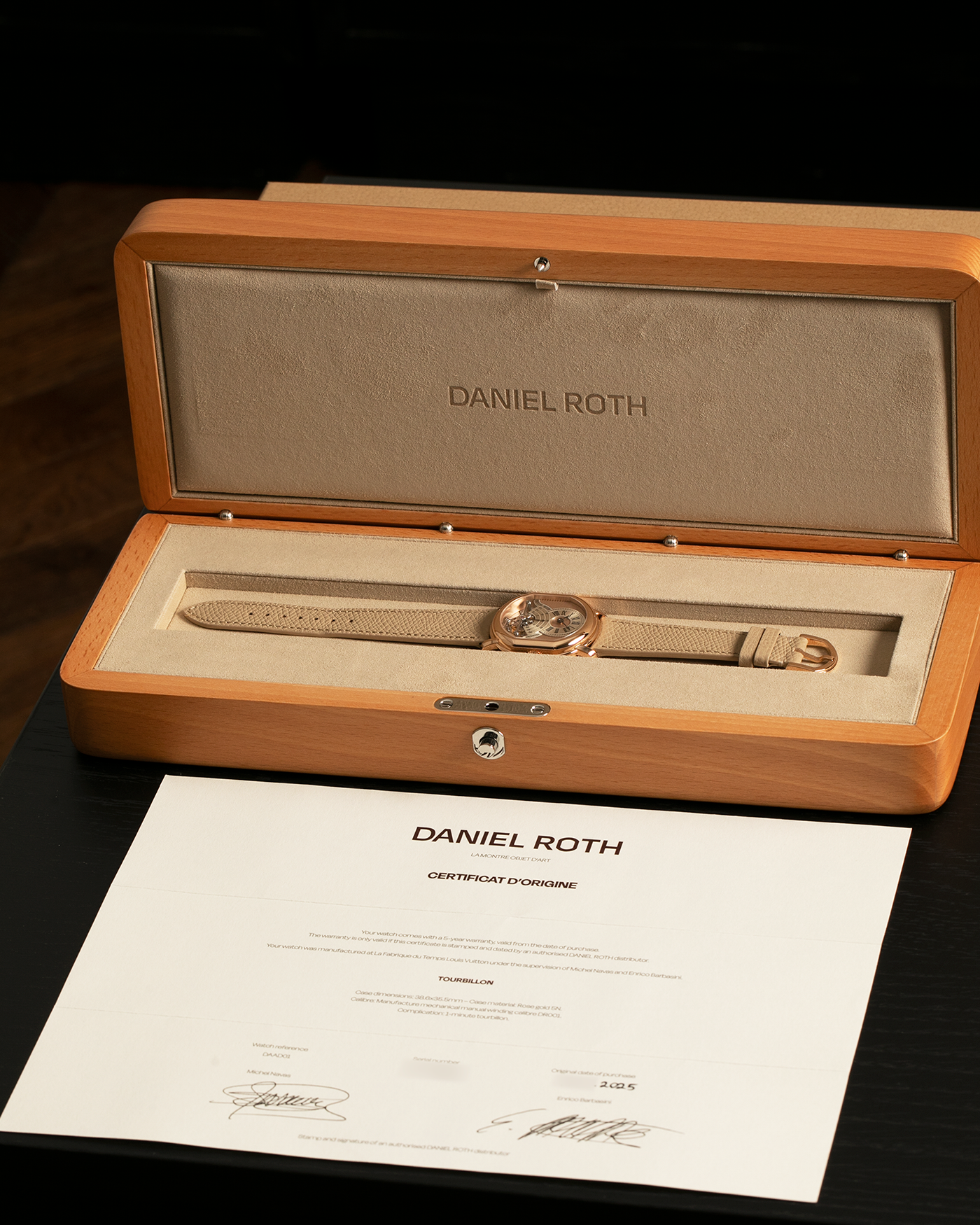 Brand: Daniel Roth
Year: 2025
Model: Tourbillon Rose Gold
Material: 18-carat Rose Gold, 925 Sterling Silver
Movement: Daniel Roth Cal. DR001, Manual-Winding
Case Dimensions: 35.5mm x 38.6mm x 9.2mm (Lug-to-Lug 42mm)
Lug Width: 20mm
Strap: Daniel Roth Taupe Calfskin Leather Strap with Signed 18-carat Rose Gold Tang Buckle