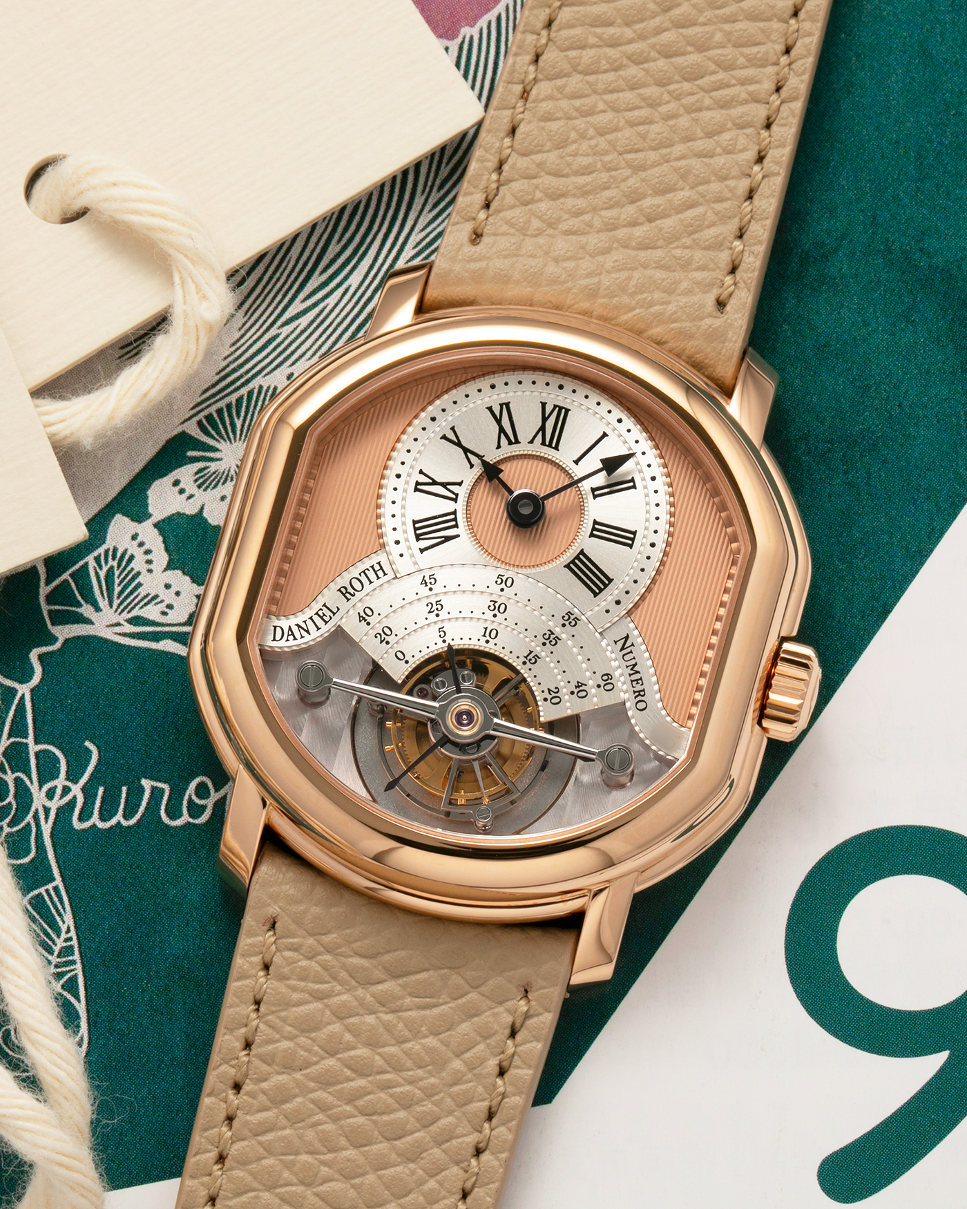 Brand: Daniel Roth
Year: 2025
Model: Tourbillon Rose Gold
Material: 18-carat Rose Gold, 925 Sterling Silver
Movement: Daniel Roth Cal. DR001, Manual-Winding
Case Dimensions: 35.5mm x 38.6mm x 9.2mm (Lug-to-Lug 42mm)
Lug Width: 20mm
Strap: Daniel Roth Taupe Calfskin Leather Strap with Signed 18-carat Rose Gold Tang Buckle