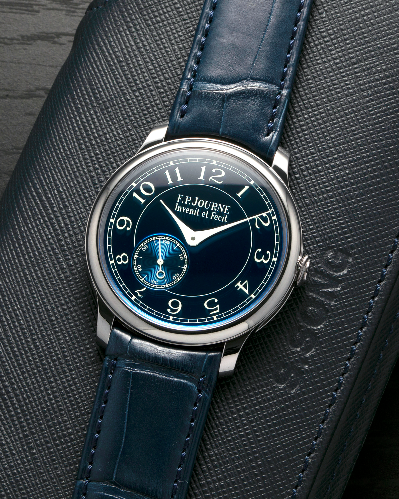 Brand: F.P. Journe
Year: 2012
Model: Chronomètre Bleu
Reference: 431-CB
Material: Tantalum Case, 18-carat Rose Gold Movement
Movement: F.P. Journe Cal. 1304, Manual-Winding
Case Dimensions: 39mm x 8.6mm (Lug-to-Lug 46mm)
Lug Width: 20mm
Straps: F.P. Journe Dark Navy Alligator Leather Strap with Signed Tantalum Tang Buckle, with extra F.P. Journe Tanned Alligator Leather Strap and a Generic Navy Blue Leather Strap with Contrasting Stitching