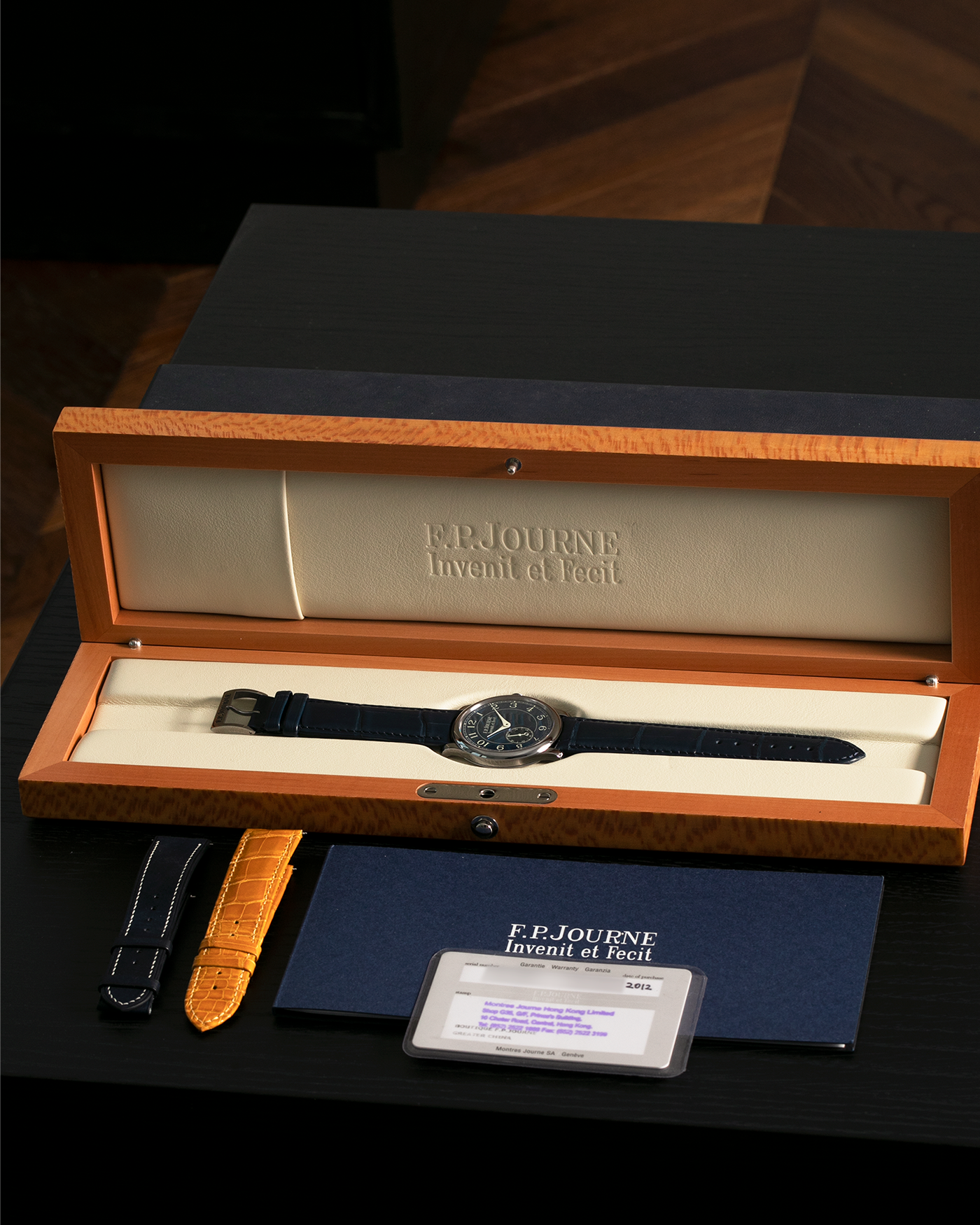 Brand: F.P. Journe
Year: 2012
Model: Chronomètre Bleu
Reference: 431-CB
Material: Tantalum Case, 18-carat Rose Gold Movement
Movement: F.P. Journe Cal. 1304, Manual-Winding
Case Dimensions: 39mm x 8.6mm (Lug-to-Lug 46mm)
Lug Width: 20mm
Straps: F.P. Journe Dark Navy Alligator Leather Strap with Signed Tantalum Tang Buckle, with extra F.P. Journe Tanned Alligator Leather Strap and a Generic Navy Blue Leather Strap with Contrasting Stitching