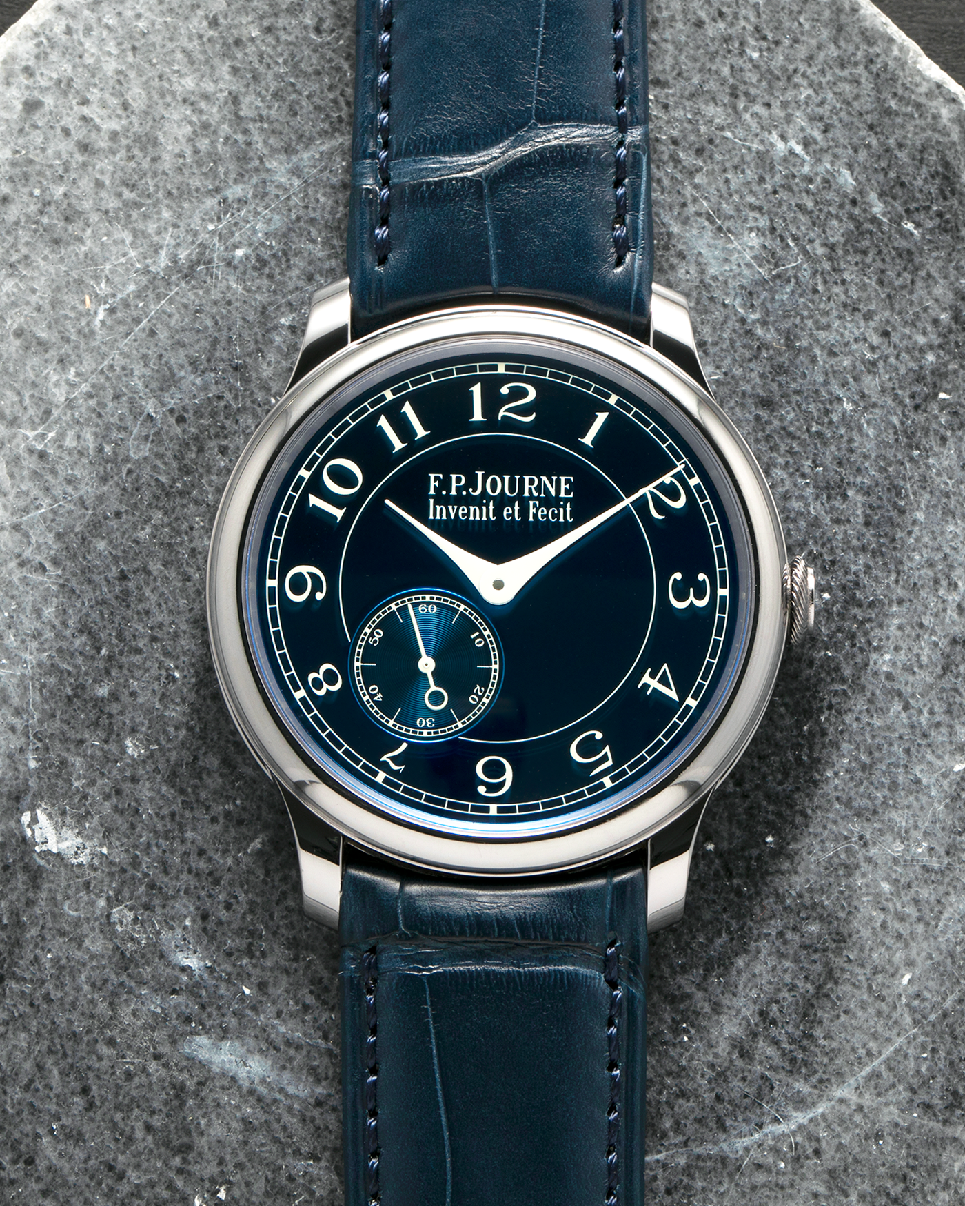 Brand: F.P. Journe
Year: 2012
Model: Chronomètre Bleu
Reference: 431-CB
Material: Tantalum Case, 18-carat Rose Gold Movement
Movement: F.P. Journe Cal. 1304, Manual-Winding
Case Dimensions: 39mm x 8.6mm (Lug-to-Lug 46mm)
Lug Width: 20mm
Straps: F.P. Journe Dark Navy Alligator Leather Strap with Signed Tantalum Tang Buckle, with extra F.P. Journe Tanned Alligator Leather Strap and a Generic Navy Blue Leather Strap with Contrasting Stitching