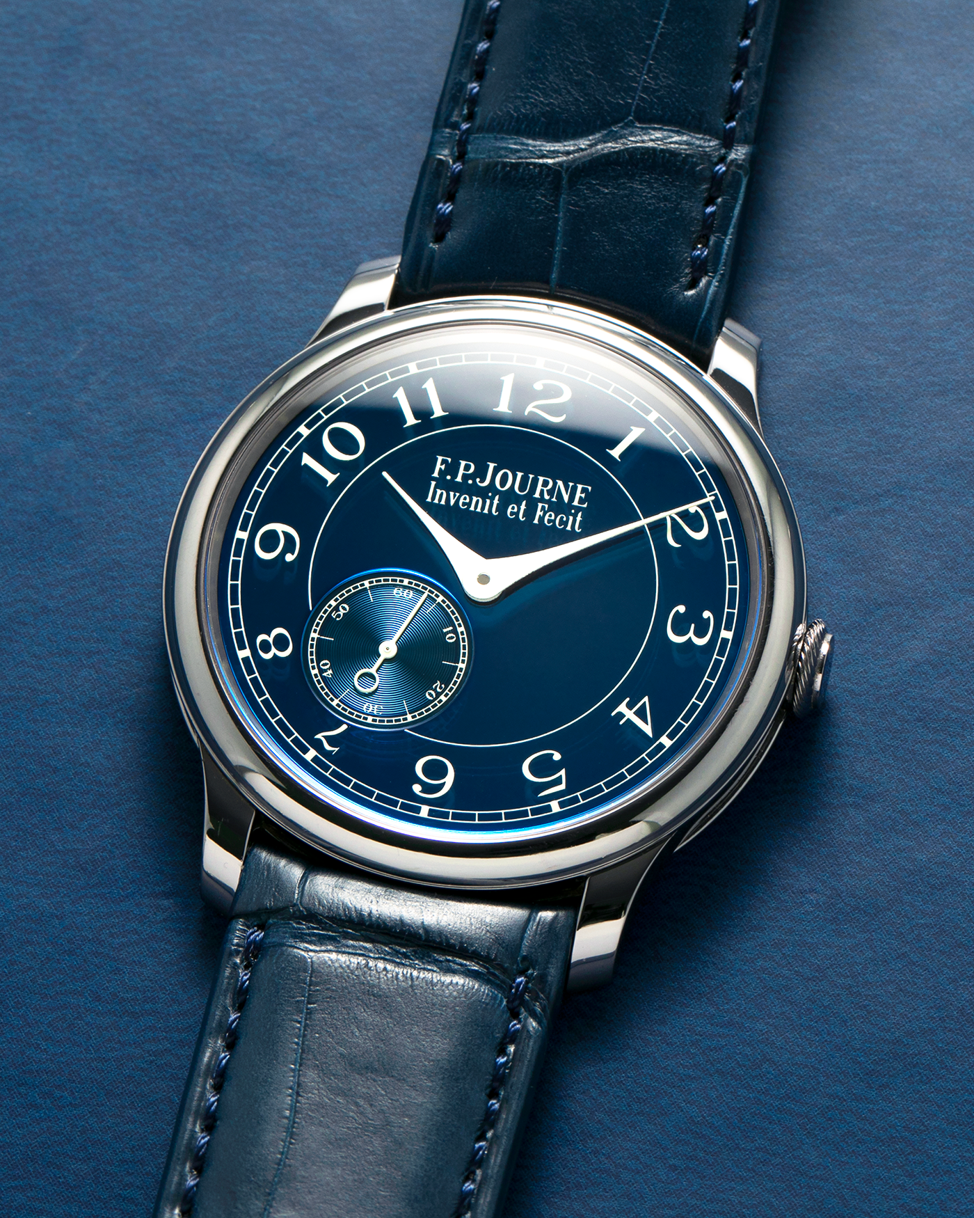 Brand: F.P. Journe
Year: 2012
Model: Chronomètre Bleu
Reference: 431-CB
Material: Tantalum Case, 18-carat Rose Gold Movement
Movement: F.P. Journe Cal. 1304, Manual-Winding
Case Dimensions: 39mm x 8.6mm (Lug-to-Lug 46mm)
Lug Width: 20mm
Straps: F.P. Journe Dark Navy Alligator Leather Strap with Signed Tantalum Tang Buckle, with extra F.P. Journe Tanned Alligator Leather Strap and a Generic Navy Blue Leather Strap with Contrasting Stitching