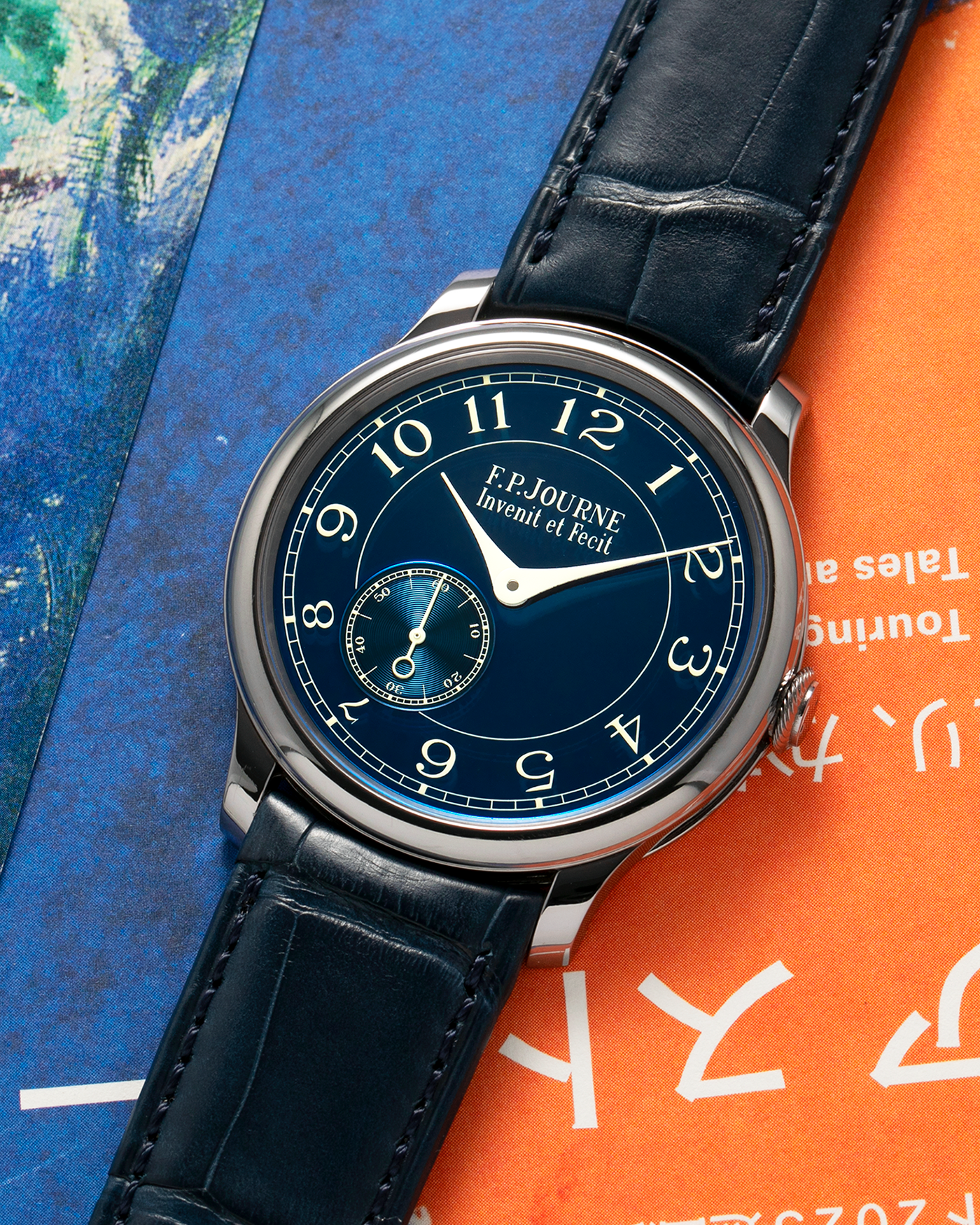 Brand: F.P. Journe
Year: 2012
Model: Chronomètre Bleu
Reference: 431-CB
Material: Tantalum Case, 18-carat Rose Gold Movement
Movement: F.P. Journe Cal. 1304, Manual-Winding
Case Dimensions: 39mm x 8.6mm (Lug-to-Lug 46mm)
Lug Width: 20mm
Straps: F.P. Journe Dark Navy Alligator Leather Strap with Signed Tantalum Tang Buckle, with extra F.P. Journe Tanned Alligator Leather Strap and a Generic Navy Blue Leather Strap with Contrasting Stitching
