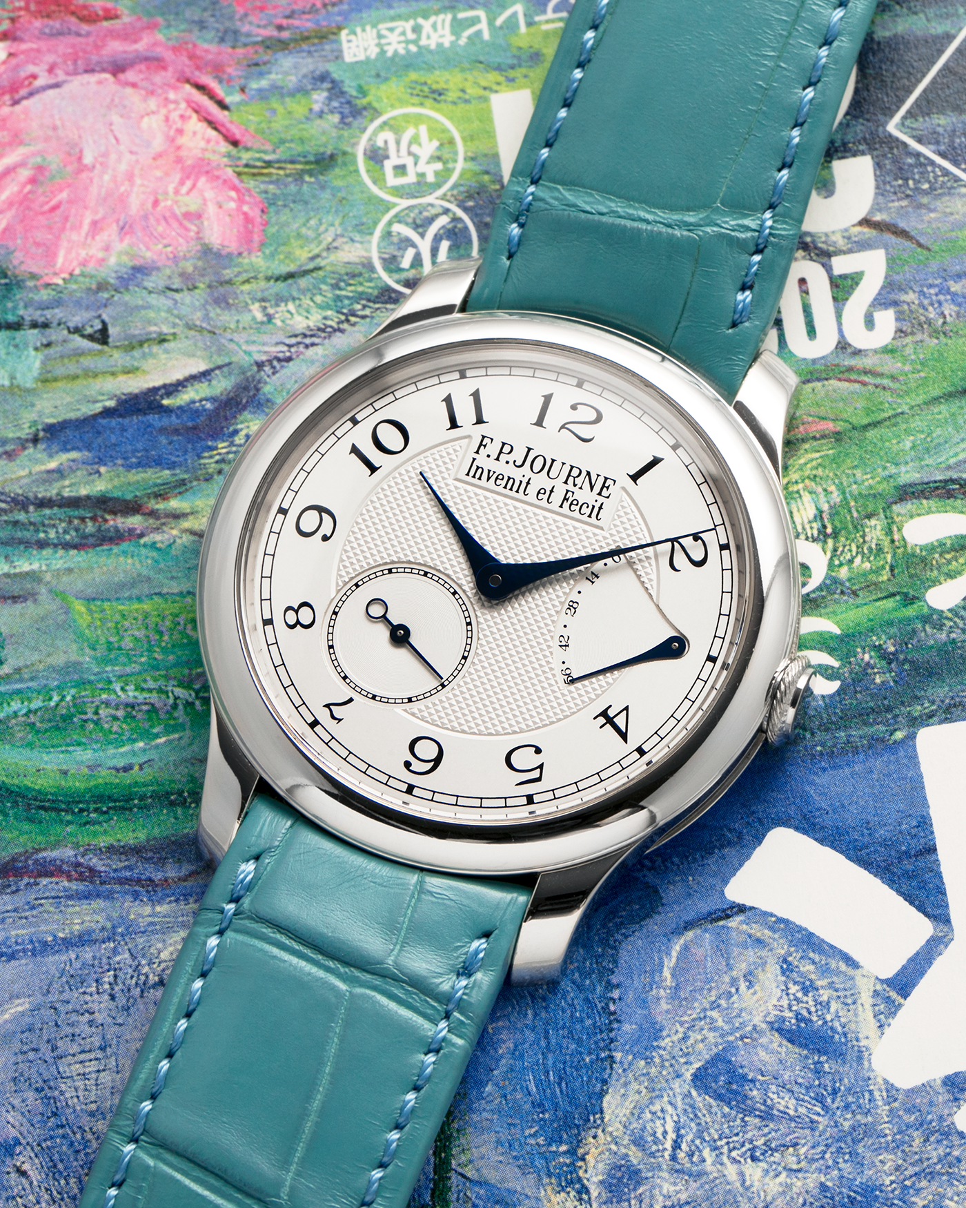 Brand: F.P. Journe
Year: 2010’s
Model: Chronomètre Souverain
Material: Platinum 950 Case, 18-Rose Gold Movement
Movement: F.P Journe Cal. 1304, Manual-Winding
Case Dimensions: 40mm x 8mm (Lug-to-Lug 48.2mm)
Lug Width: 20mm
Strap: F.P Journe Teal Alligator Leather Strap with Signed Platinum 950 Tang Buckle
