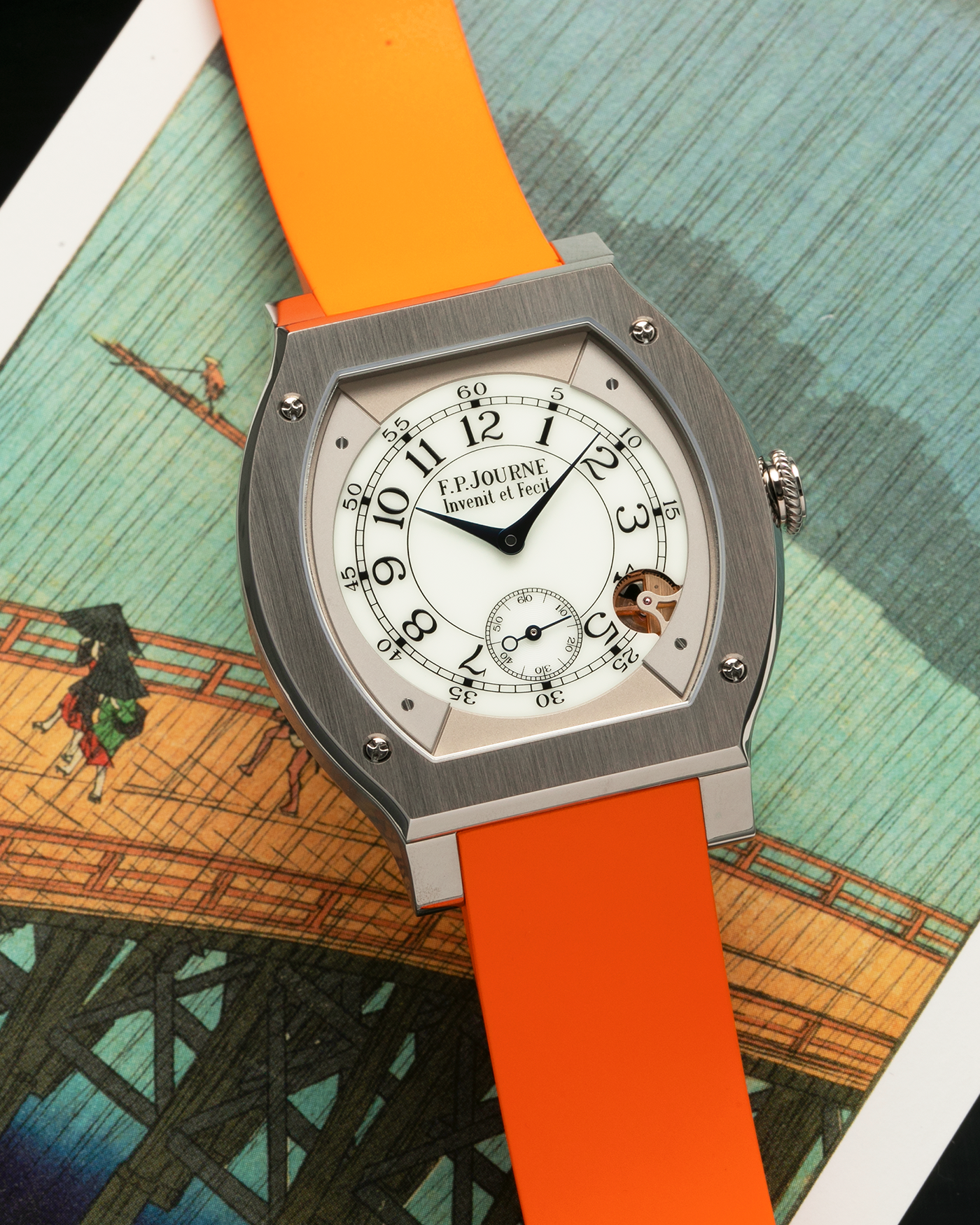 Brand: F.P. Journe
Year: 2021
Model: Elegante 48
Reference: ELHT
Material: Titanium
Movement: F.P. Journe Cal. 1210, Electromechanical Quartz
Case Dimensions: 48mm (Including Lugs) x 40mm x 7.95mm
Lug Width: 18mm
Strap: F.P. Journe Orange Sillicon Rubber Strap with Signed Titanium Tang Buckle