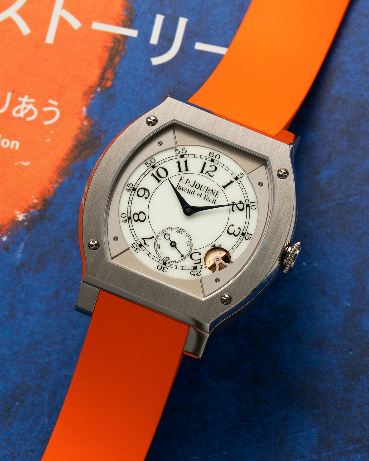 Brand: F.P. Journe
Year: 2021
Model: Elegante 48
Reference: ELHT
Material: Titanium
Movement: F.P. Journe Cal. 1210, Electromechanical Quartz
Case Dimensions: 48mm (Including Lugs) x 40mm x 7.95mm
Lug Width: 18mm
Strap: F.P. Journe Orange Sillicon Rubber Strap with Signed Titanium Tang Buckle