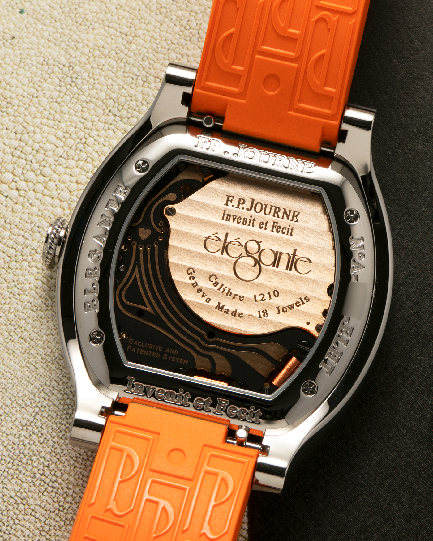 Brand: F.P. Journe
Year: 2021
Model: Elegante 48
Reference: ELHT
Material: Titanium
Movement: F.P. Journe Cal. 1210, Electromechanical Quartz
Case Dimensions: 48mm (Including Lugs) x 40mm x 7.95mm
Lug Width: 18mm
Strap: F.P. Journe Orange Sillicon Rubber Strap with Signed Titanium Tang Buckle