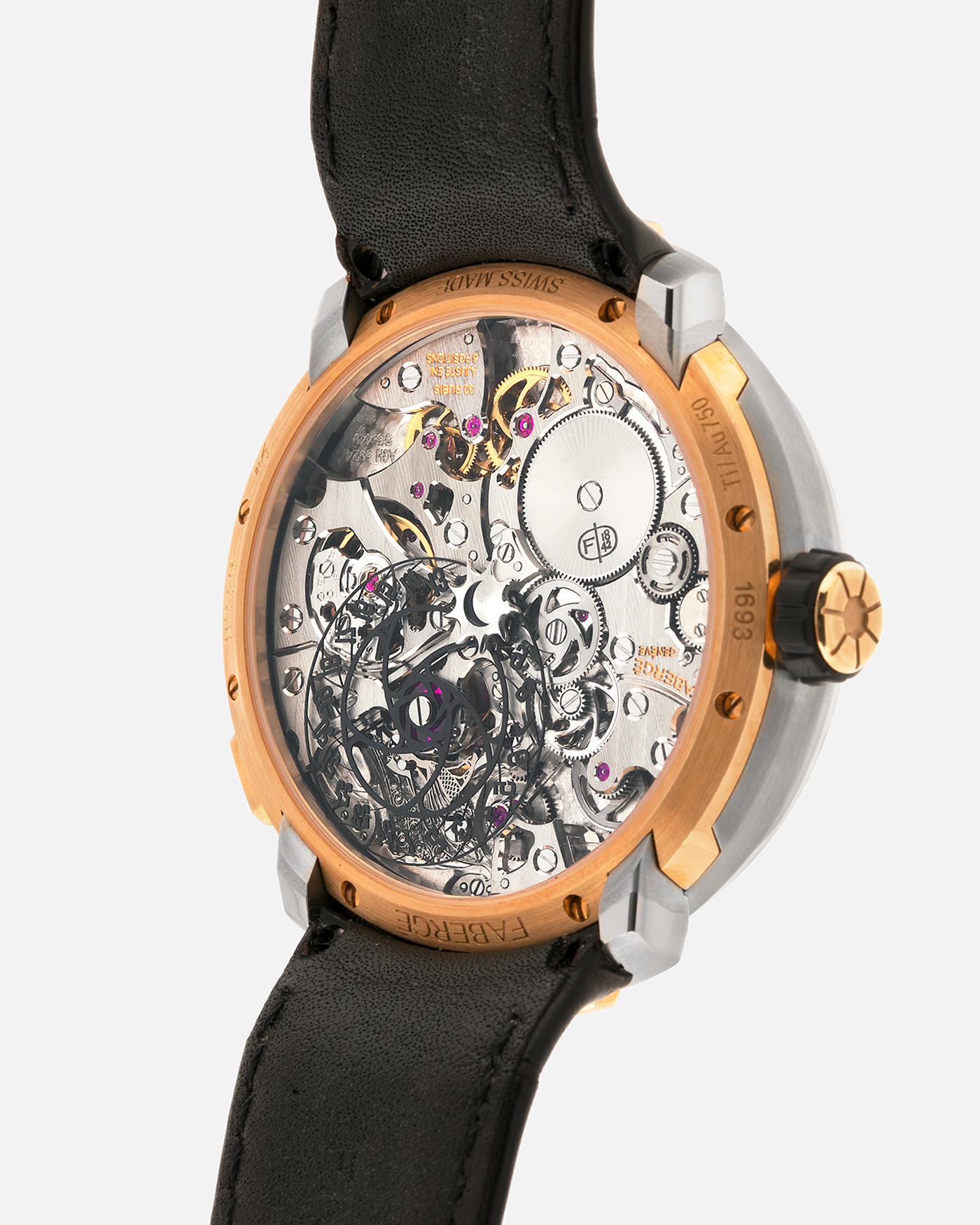 Brand: Fabergé
Year: 2016 (Approximation)
Model: Visionnaire DTZ Dual Time Zone
Material: 18k Rose Gold and Titanium
Movement: Self-Winding Agenhor AGH 6924 (Peripheral Rotor)
Case Dimensions: 43m Diameter 14.2mm Thickness
Strap: Fabergé Black Alligator Strap With Signed 18k Rose Gold Deployant Clasp