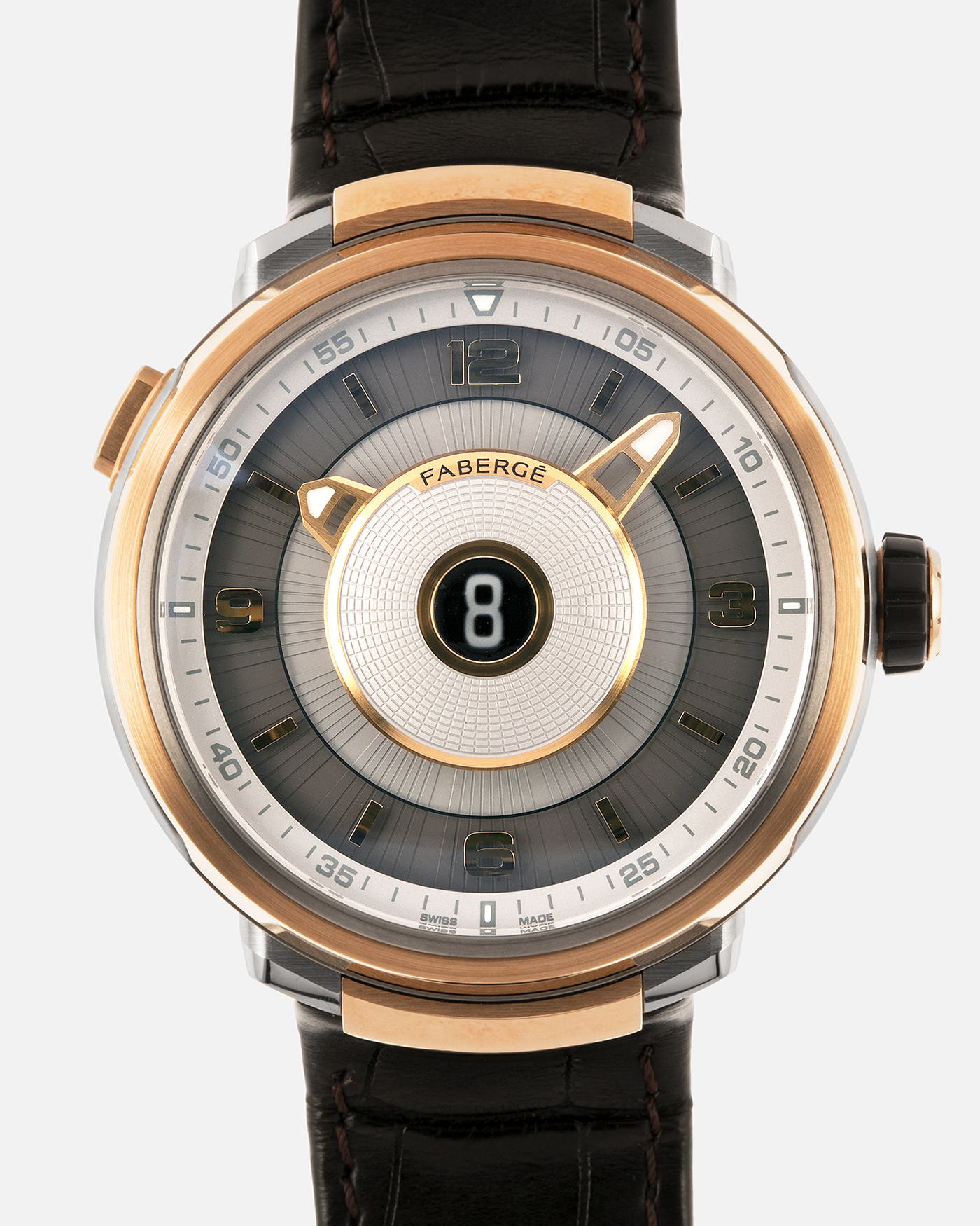 Brand: Fabergé
Year: 2016 (Approximation)
Model: Visionnaire DTZ Dual Time Zone
Material: 18k Rose Gold and Titanium
Movement: Self-Winding Agenhor AGH 6924 (Peripheral Rotor)
Case Dimensions: 43m Diameter 14.2mm Thickness
Strap: Fabergé Black Alligator Strap With Signed 18k Rose Gold Deployant Clasp