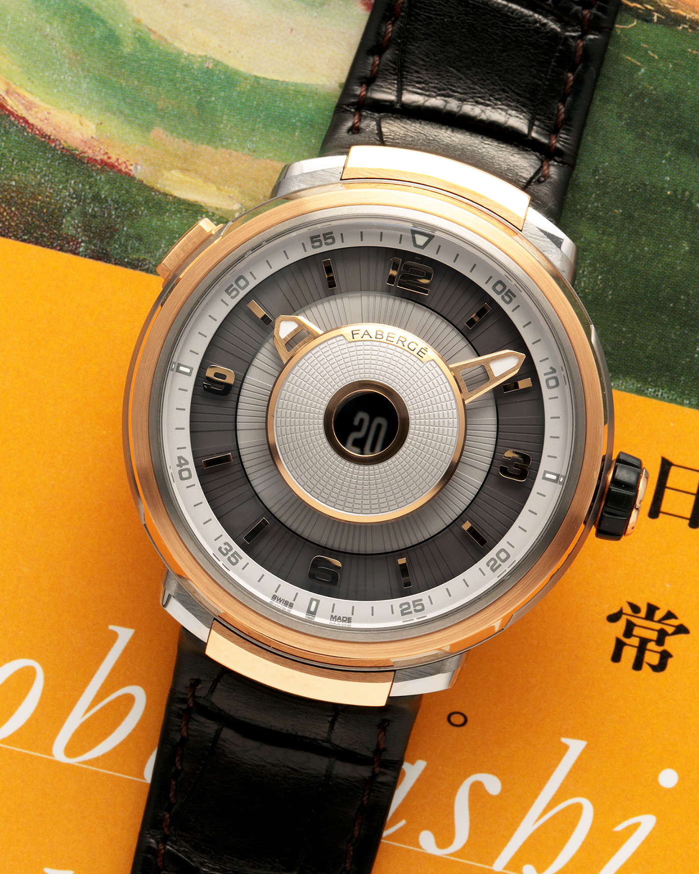 Brand: Fabergé
Year: 2016 (Approximation)
Model: Visionnaire DTZ Dual Time Zone
Material: 18k Rose Gold and Titanium
Movement: Self-Winding Agenhor AGH 6924 (Peripheral Rotor)
Case Dimensions: 43m Diameter 14.2mm Thickness
Strap: Fabergé Black Alligator Strap With Signed 18k Rose Gold Deployant Clasp