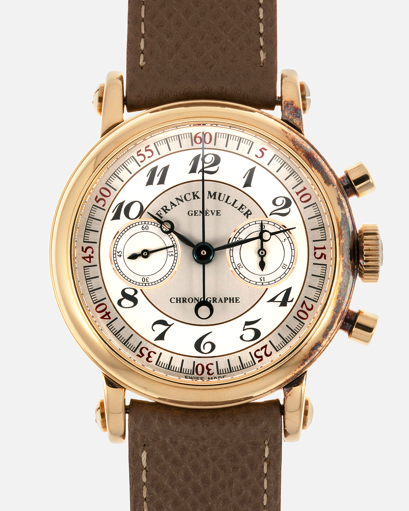Brand: Franck Muller Year: 2000’s Model: Chronographe Double Face Reference: 2870 NA DF Material: 18-carat Yellow Gold Movement: Lemania Cal. 1872, Manual-Winding Case Diameter: 37mm Strap: Nostime Sand Tan Suede Calf Leather Strap with Signed 18-carat Tang Buckle, Additional Franck Muller Black Alligator Leather Strap.