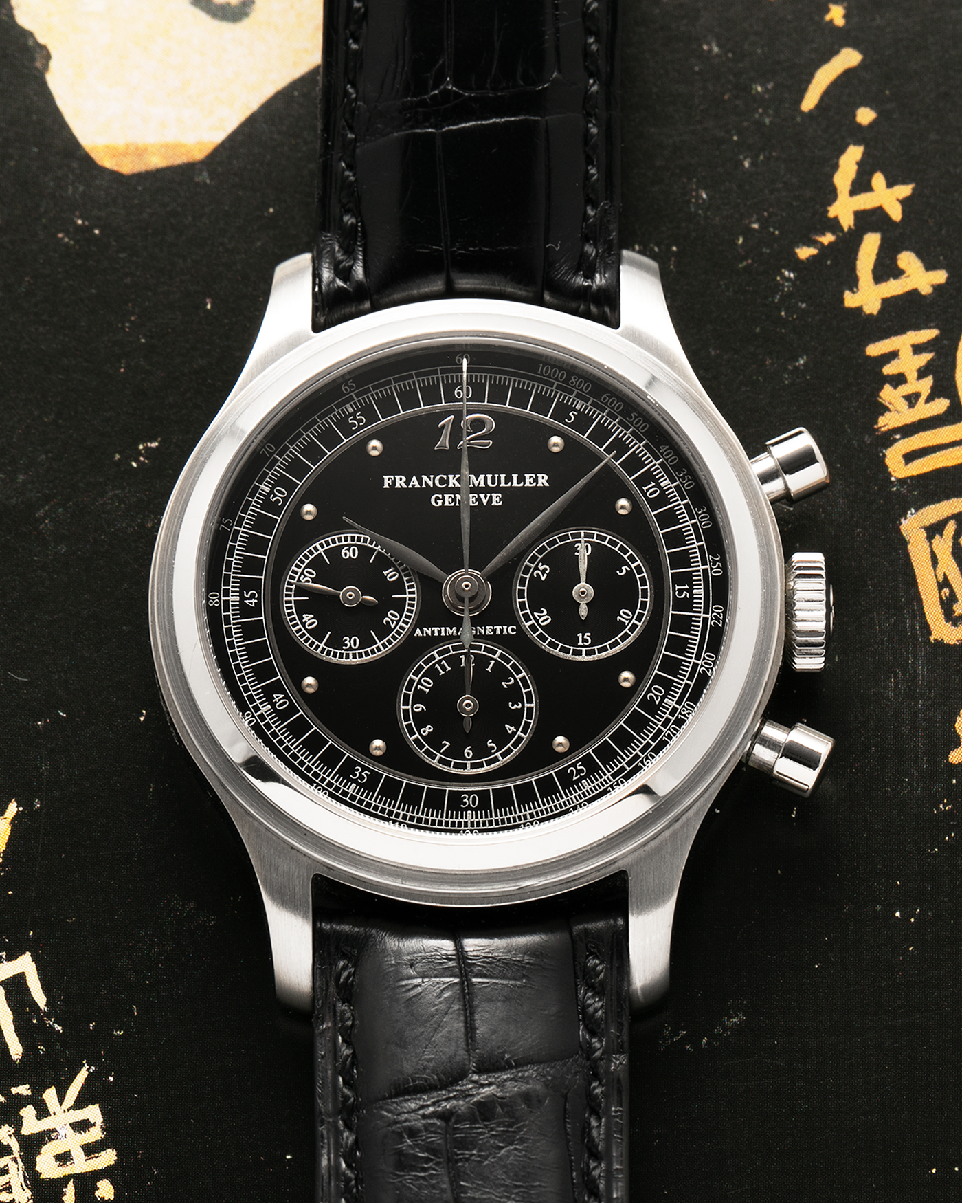 Brand: Franck Muller
Year: 1990’s
Model: Sport Limited Edition Chronograph, Mercedes-Benz Edition
Material: Stainless Steel
Movement: Modified Lemania Cal. 1874, Manual-Winding
Case Dimensions: 37mm Diameter, 12.5mm Thickness
Lug Width: 18mm
Bracelet: Franck Muller Black Alligator Strap with Stainless Steel Franck Muller Tang Buckle