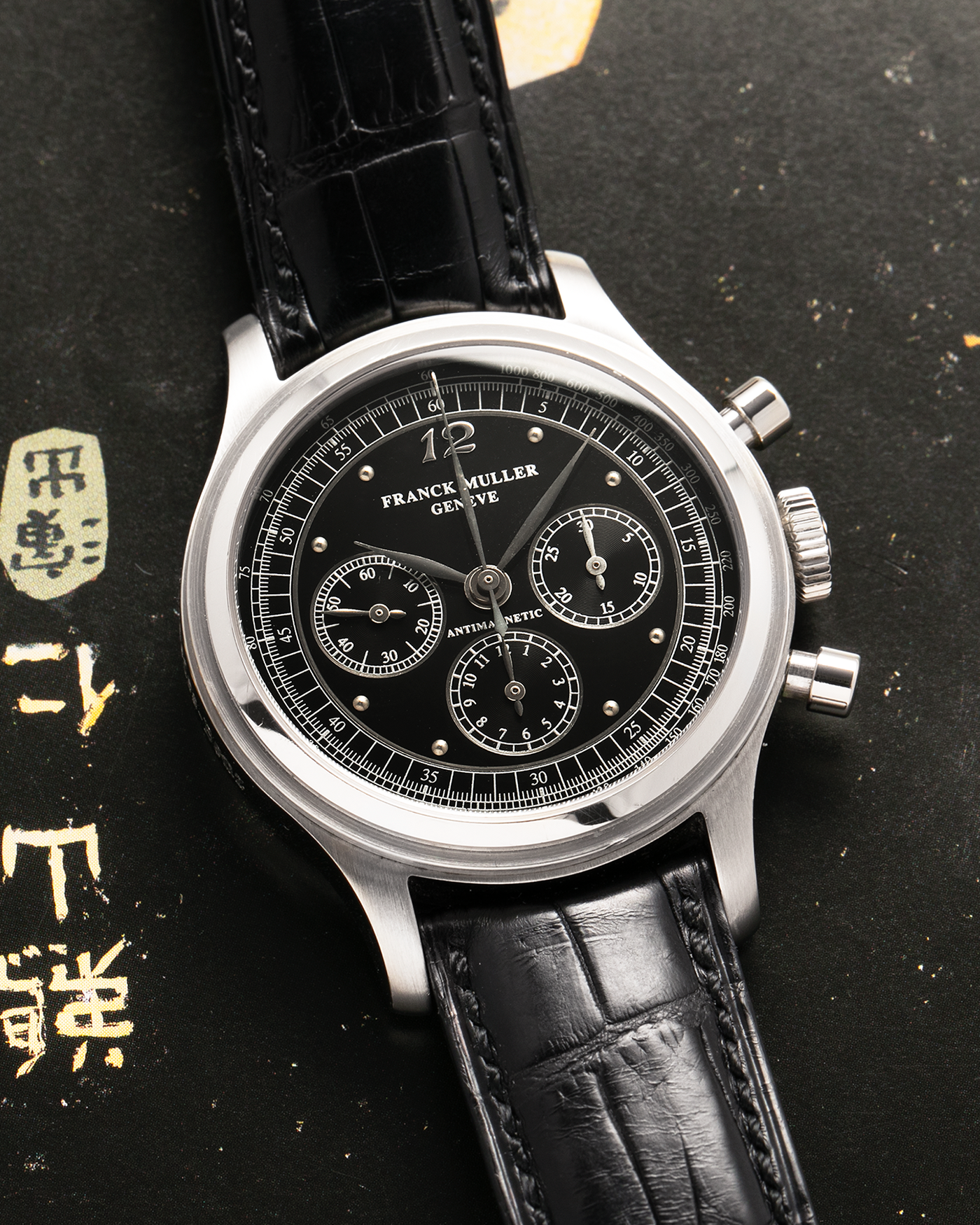 Brand: Franck Muller
Year: 1990’s
Model: Sport Limited Edition Chronograph, Mercedes-Benz Edition
Material: Stainless Steel
Movement: Modified Lemania Cal. 1874, Manual-Winding
Case Dimensions: 37mm Diameter, 12.5mm Thickness
Lug Width: 18mm
Bracelet: Franck Muller Black Alligator Strap with Stainless Steel Franck Muller Tang Buckle