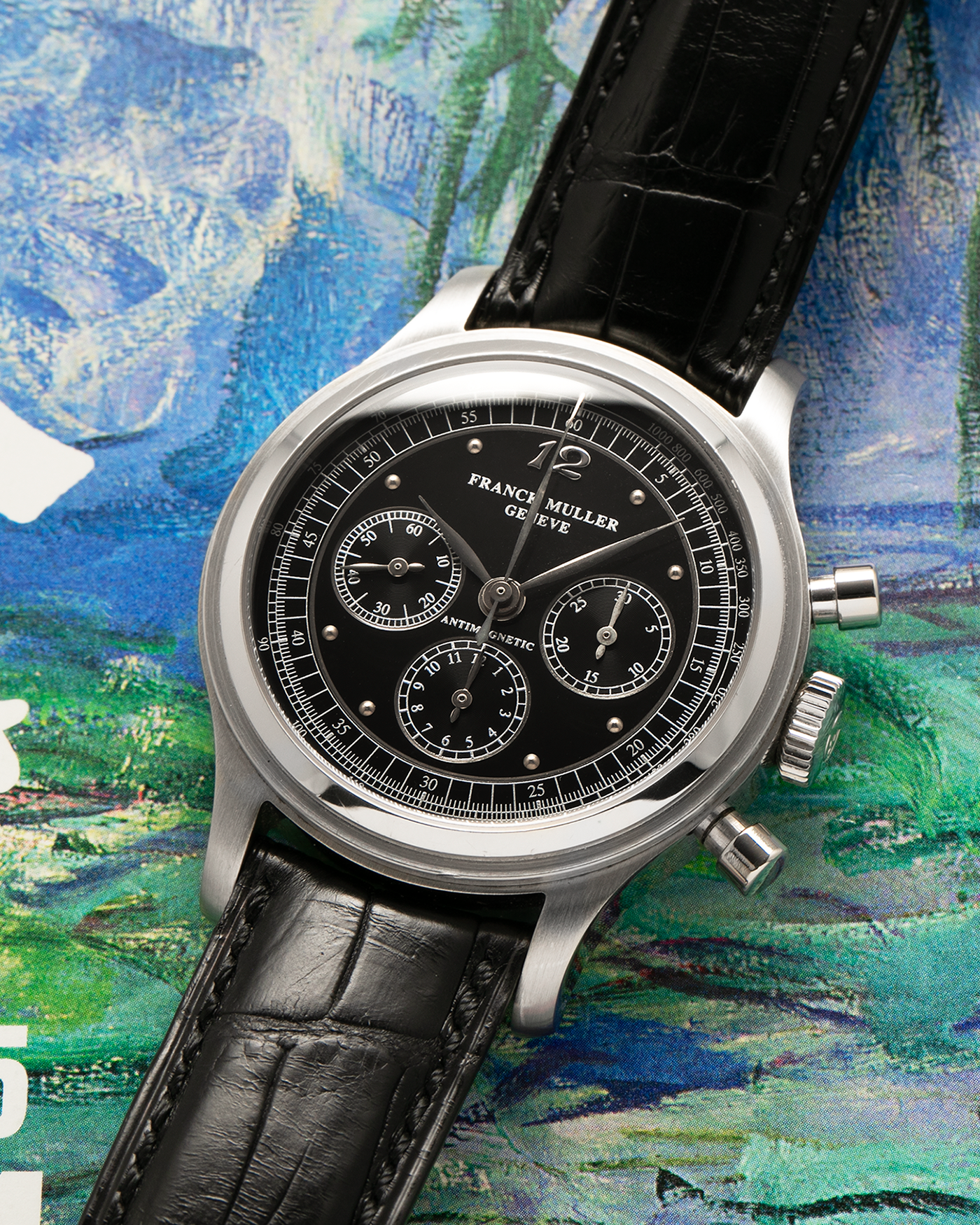 Brand: Franck Muller
Year: 1990’s
Model: Sport Limited Edition Chronograph, Mercedes-Benz Edition
Material: Stainless Steel
Movement: Modified Lemania Cal. 1874, Manual-Winding
Case Dimensions: 37mm Diameter, 12.5mm Thickness
Lug Width: 18mm
Bracelet: Franck Muller Black Alligator Strap with Stainless Steel Franck Muller Tang Buckle