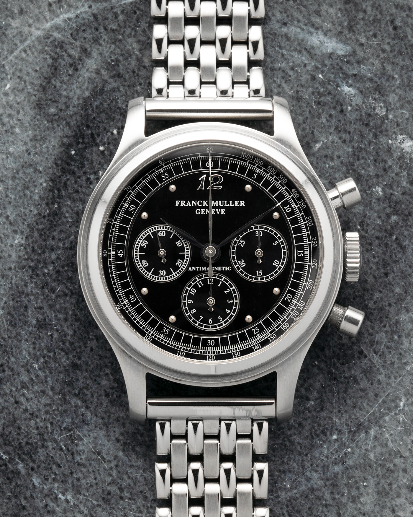 Brand: Franck Muller
Year: 1990’s
Model: Sport Limited Edition Chronograph
Material: Stainless Steel
Movement: Modified Lemania Cal. 1874, Manual-Winding
Case Dimensions: 37mm x 12.5mm (Lug-to-Lug 46.3mm)
Lug Width: 18mm
Bracelet: Private Eyes Beads of Rice Bracelet in Stainless Steel