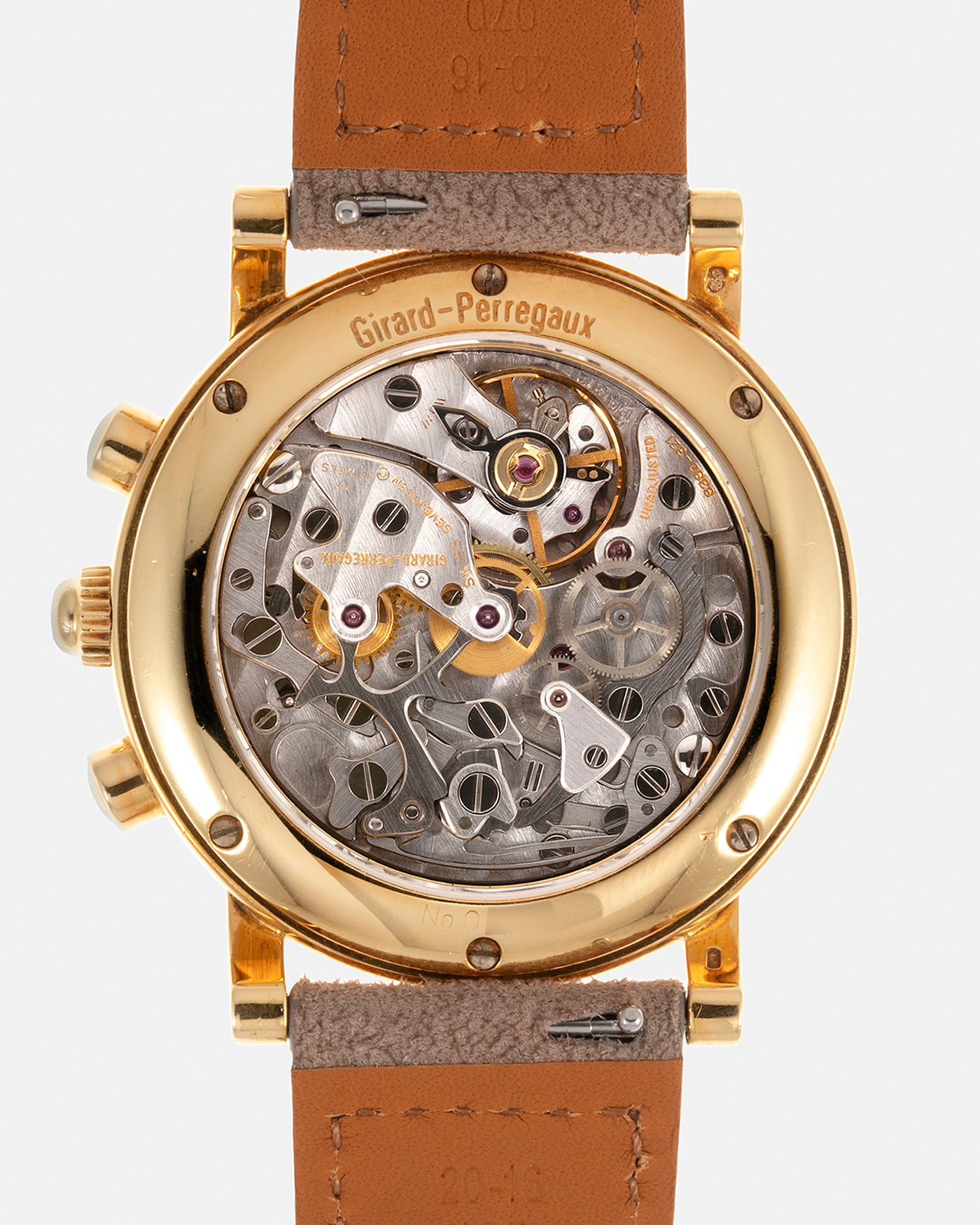 Brand: Girard Perregaux Year: 1990’s Reference Number: 47930 Material: 18k Yellow Gold Movement: Lemania Cal. 1872  Case Diameter: 38mm Strap: Molequin Taupe Suede Strap and 18k Yellow Gold Girard Perregaux Tan Buckle