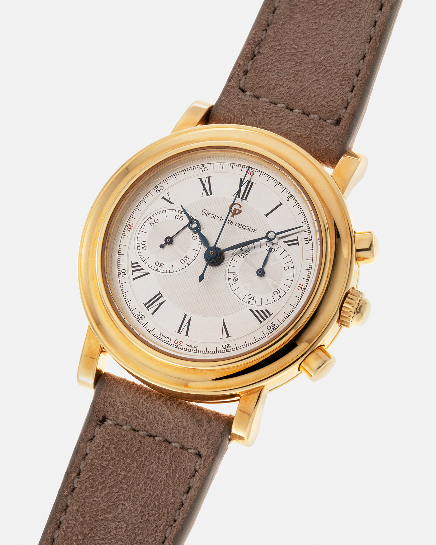 Brand: Girard Perregaux Year: 1990’s Reference Number: 47930 Material: 18k Yellow Gold Movement: Lemania Cal. 1872  Case Diameter: 38mm Strap: Molequin Taupe Suede Strap and 18k Yellow Gold Girard Perregaux Tan Buckle