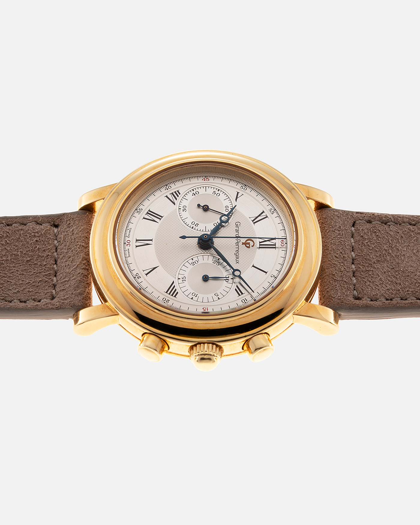 Brand: Girard Perregaux Year: 1990’s Reference Number: 47930 Material: 18k Yellow Gold Movement: Lemania Cal. 1872  Case Diameter: 38mm Strap: Molequin Taupe Suede Strap and 18k Yellow Gold Girard Perregaux Tan Buckle