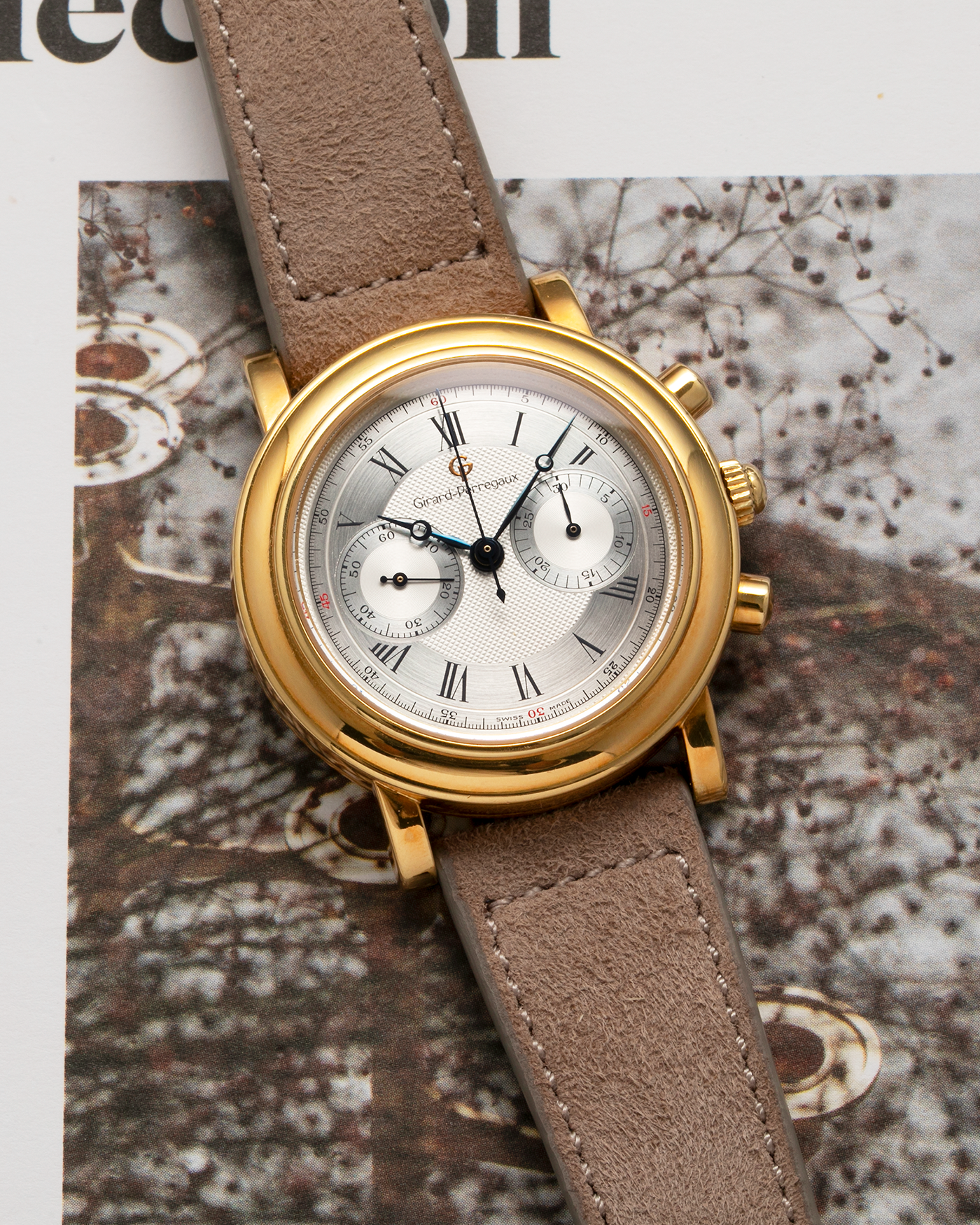 Brand: Girard Perregaux Year: 1990’s Reference Number: 47930 Material: 18k Yellow Gold Movement: Lemania Cal. 1872  Case Diameter: 38mm Strap: Molequin Taupe Suede Strap and 18k Yellow Gold Girard Perregaux Tan Buckle