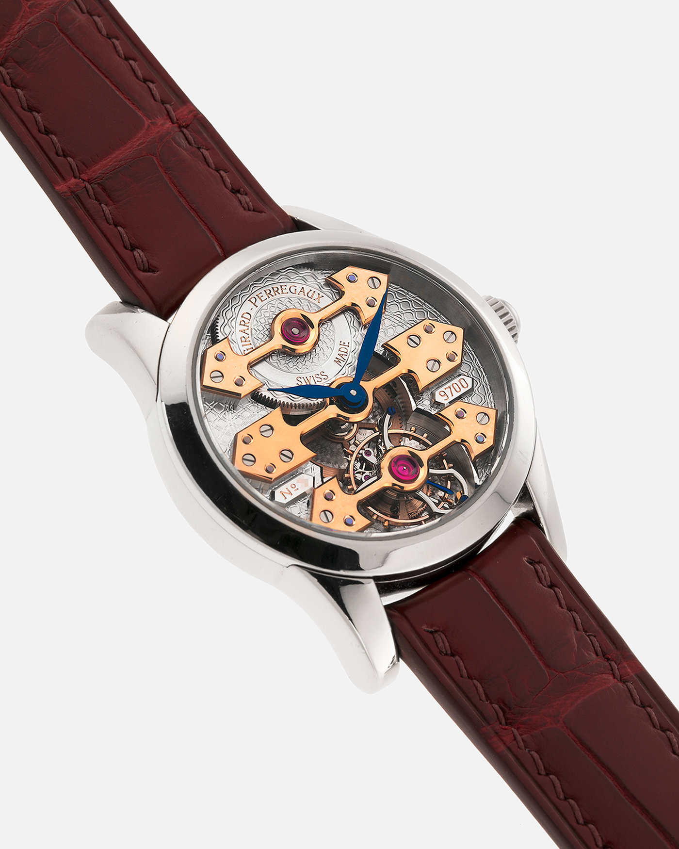 Brand: Girard Perregaux
Year: Late 90’s / Early 2000’s
Model: Three Bridges Tourbillon, “Tourbillon Sous Trois Ponts d'Or”
Reference: 9700
Material: 18k White Gold
Movement: Manual-Winding Girard Perregaux Cal. T3P
Case Dimensions: 31mm Diameter 9mm Thickness
Lug Width: 20mm
Strap: Custom Order Burgundy Alligator Strap, Girard Perregaux Iridescent Blue Alligator Strap and 18k White Gold Girard Perregaux Deployant Clasp