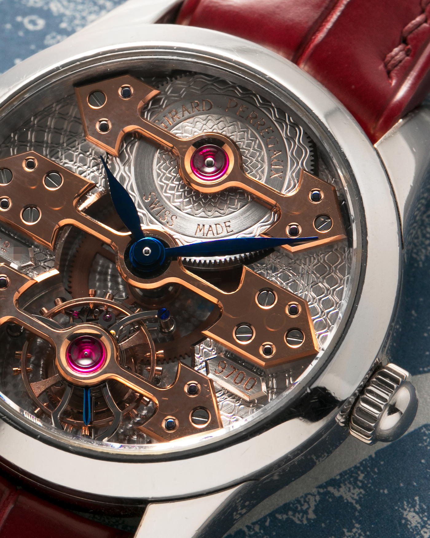 Brand: Girard Perregaux
Year: Late 90’s / Early 2000’s
Model: Three Bridges Tourbillon, “Tourbillon Sous Trois Ponts d'Or”
Reference: 9700
Material: 18k White Gold
Movement: Manual-Winding Girard Perregaux Cal. T3P
Case Dimensions: 31mm Diameter 9mm Thickness
Lug Width: 20mm
Strap: Custom Order Burgundy Alligator Strap, Girard Perregaux Iridescent Blue Alligator Strap and 18k White Gold Girard Perregaux Deployant Clasp