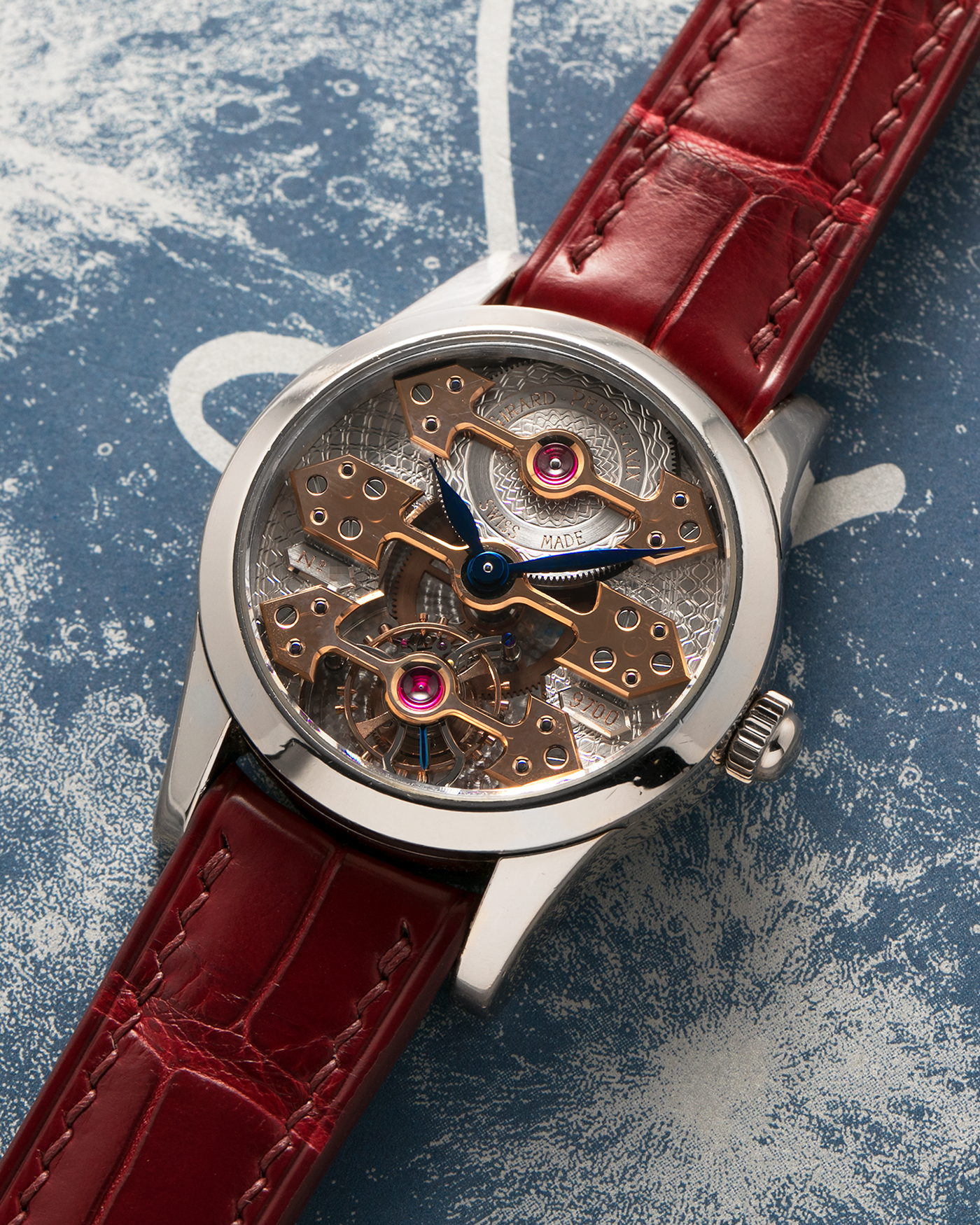Brand: Girard Perregaux
Year: Late 90’s / Early 2000’s
Model: Three Bridges Tourbillon, “Tourbillon Sous Trois Ponts d'Or”
Reference: 9700
Material: 18k White Gold
Movement: Manual-Winding Girard Perregaux Cal. T3P
Case Dimensions: 31mm Diameter 9mm Thickness
Lug Width: 20mm
Strap: Custom Order Burgundy Alligator Strap, Girard Perregaux Iridescent Blue Alligator Strap and 18k White Gold Girard Perregaux Deployant Clasp