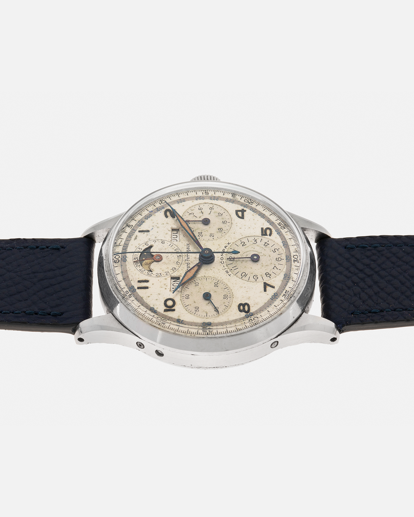 Brand: Girard Perregaux
Year: 1940s
Model: Tri-Compax
Material: Stainless Steel
Movement: Universal Genève (Branded Girard Perregaux) Cal. 287, Manual-Winding
Case Diameter: 37mm x 13mm (Lug-to-Lug 44.5mm)
Lug Width: 19mm
Strap: Nostime Dark Navy Textured Calf Leather Strap