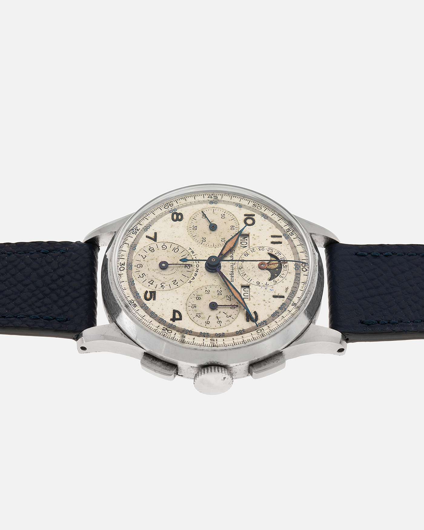 Brand: Girard Perregaux
Year: 1940s
Model: Tri-Compax
Material: Stainless Steel
Movement: Universal Genève (Branded Girard Perregaux) Cal. 287, Manual-Winding
Case Diameter: 37mm x 13mm (Lug-to-Lug 44.5mm)
Lug Width: 19mm
Strap: Nostime Dark Navy Textured Calf Leather Strap