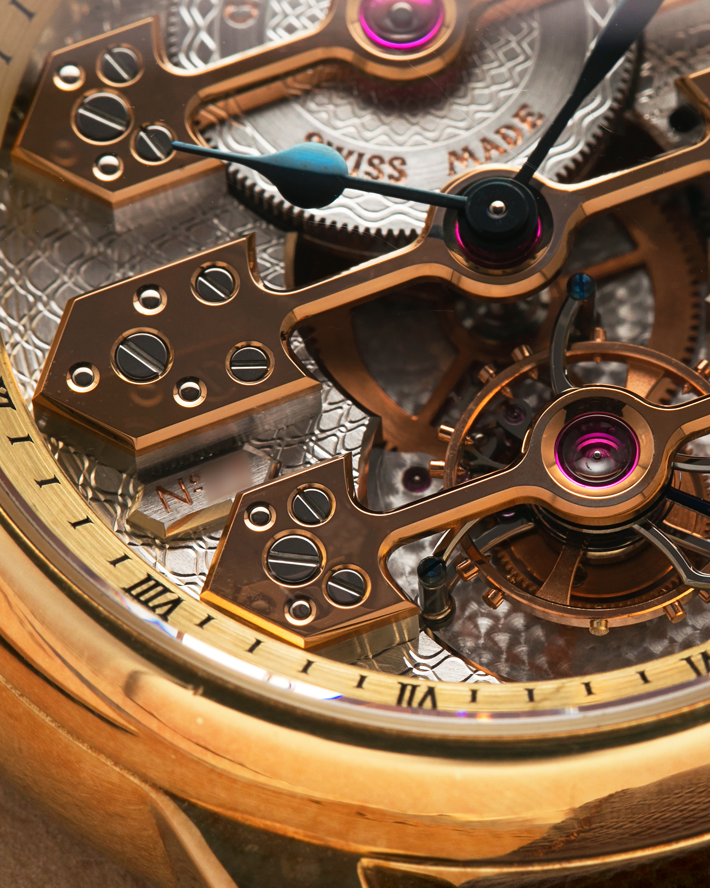 Brand: Girard Perregaux  Year: Mid-1990s Model: Three Bridges Tourbillon, “Tourbillon Sous Trois Ponts d'Or” Reference: 99000 Material: 18-carat Yellow Gold  Movement: Girard Perregaux Cal. 9910 Tourbillon, Manual-Winding  Case Dimensions: 39mm x 10.5mm (Lug-to-Lug 44.5mm)  Lug Width: 20mm  Strap: Phillips Dark Brown Textured Calf Leather Strap with Signed 18-carat Yellow Gold Tang Buckle 