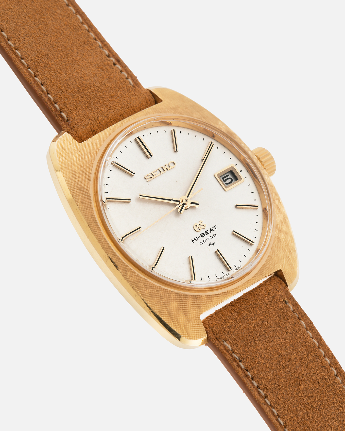 Brand: Grand Seiko
Year: Circa 1970’s
Reference Number: 4522-8010
Material: 18-carat Yellow Gold
Movement: Cal. 4520A
Case Diameter: 36mm Diameter 9mm Thickness
Lug Width: 18mm
Bracelet/Strap: Nostime Cognac Suede Strap and Unsigned Buckle