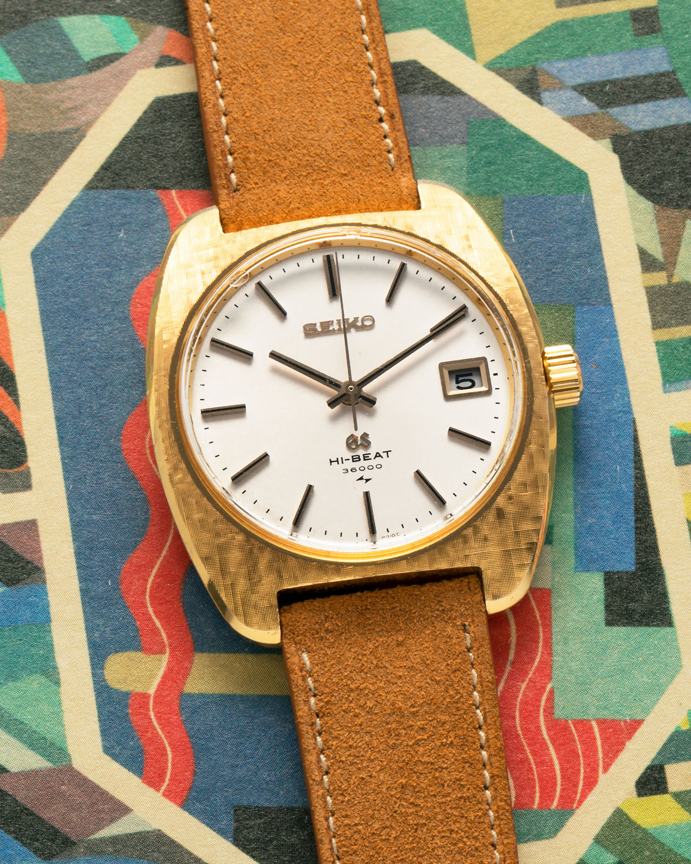 Brand: Grand Seiko
Year: Circa 1970’s
Reference Number: 4522-8010
Material: 18-carat Yellow Gold
Movement: Cal. 4520A
Case Diameter: 36mm Diameter 9mm Thickness
Lug Width: 18mm
Bracelet/Strap: Nostime Cognac Suede Strap and Unsigned Buckle
