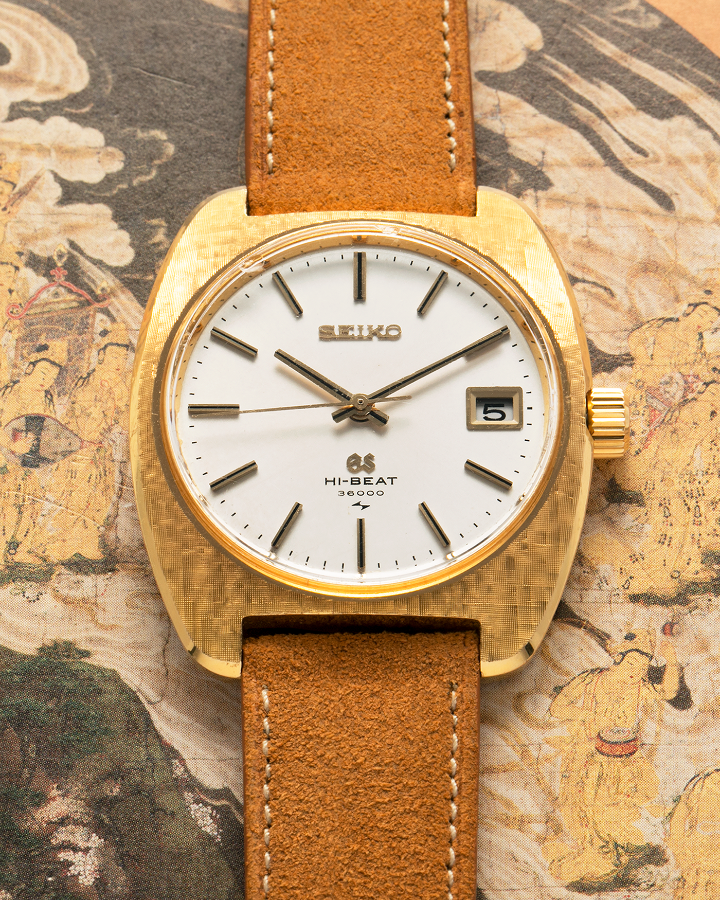 Brand: Grand Seiko
Year: Circa 1970’s
Reference Number: 4522-8010
Material: 18-carat Yellow Gold
Movement: Cal. 4520A
Case Diameter: 36mm Diameter 9mm Thickness
Lug Width: 18mm
Bracelet/Strap: Nostime Cognac Suede Strap and Unsigned Buckle