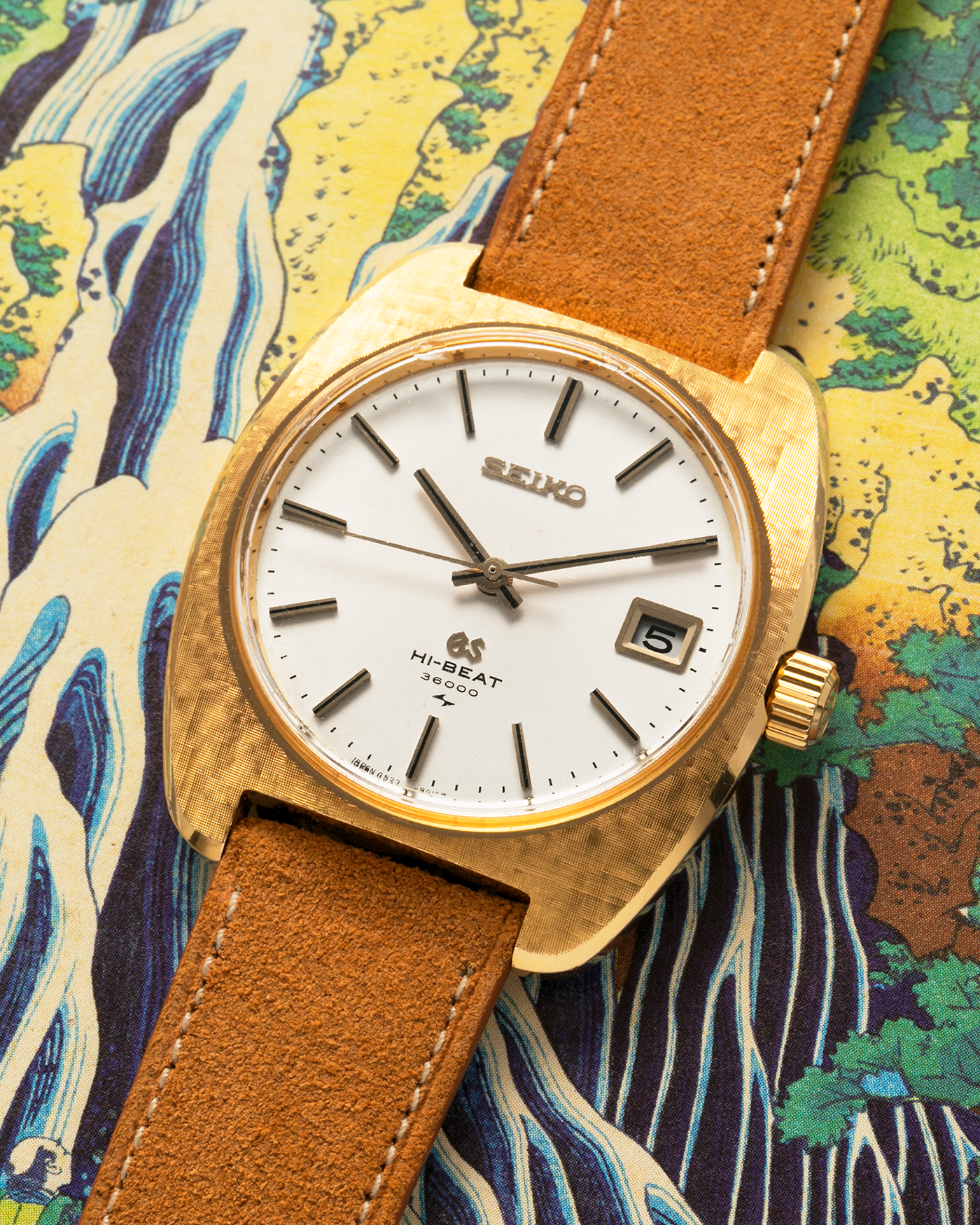 Brand: Grand Seiko
Year: Circa 1970’s
Reference Number: 4522-8010
Material: 18-carat Yellow Gold
Movement: Cal. 4520A
Case Diameter: 36mm Diameter 9mm Thickness
Lug Width: 18mm
Bracelet/Strap: Nostime Cognac Suede Strap and Unsigned Buckle