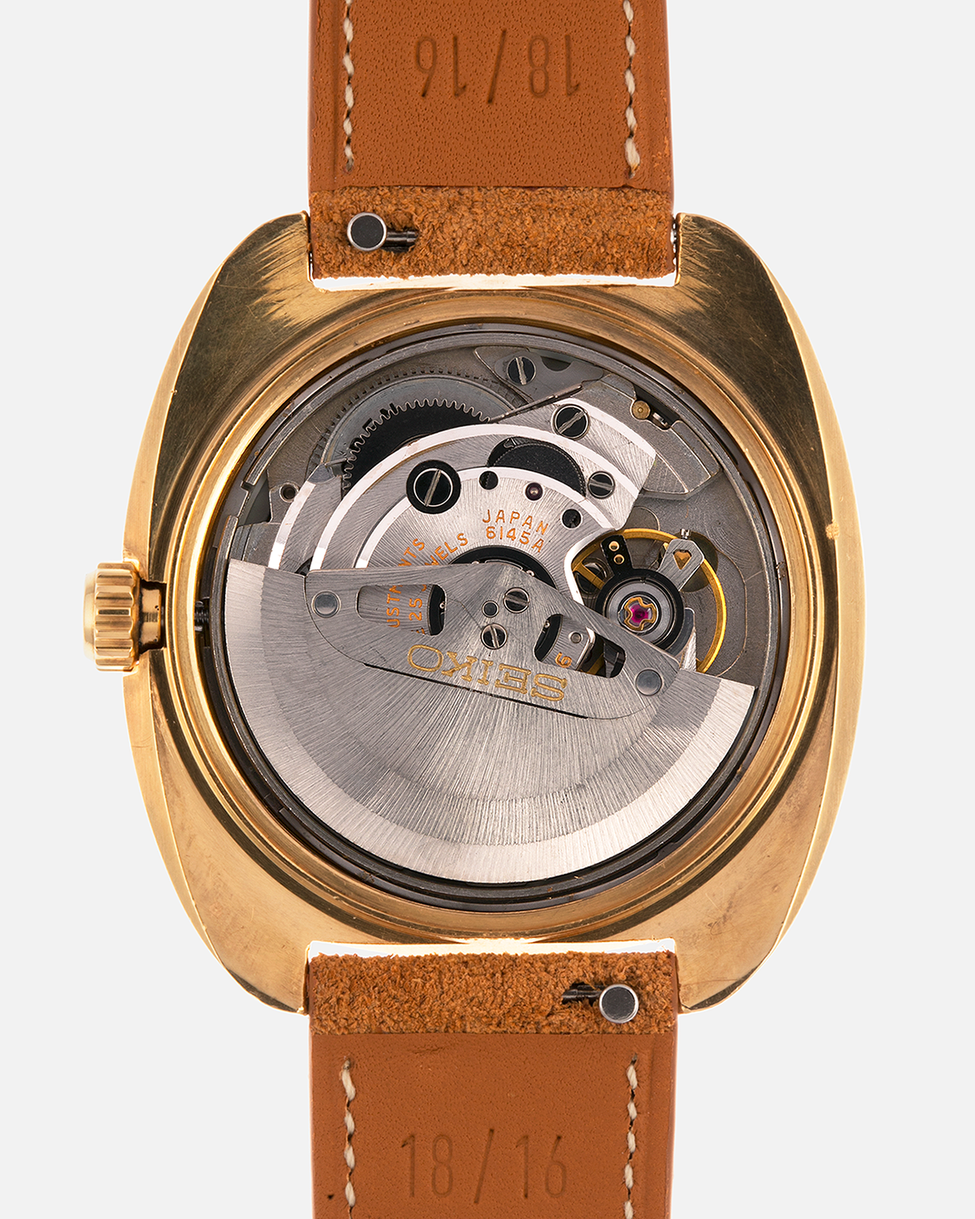 Brand: Grand Seiko
Year: Late 1960’s/1970’s
Model: 61GS
Reference Number: 6145-8030 ‘Kirazuri’
Material: 18-carat Yellow Gold
Movement: Self-Winding Hi Beat Cal. 6145
Case Dimensions: 37mm Diameter 11mm Thickness
Lug Width: 18mm
Strap: Nostime Tan Suede Strap with Generic Stainless Steel Buckle