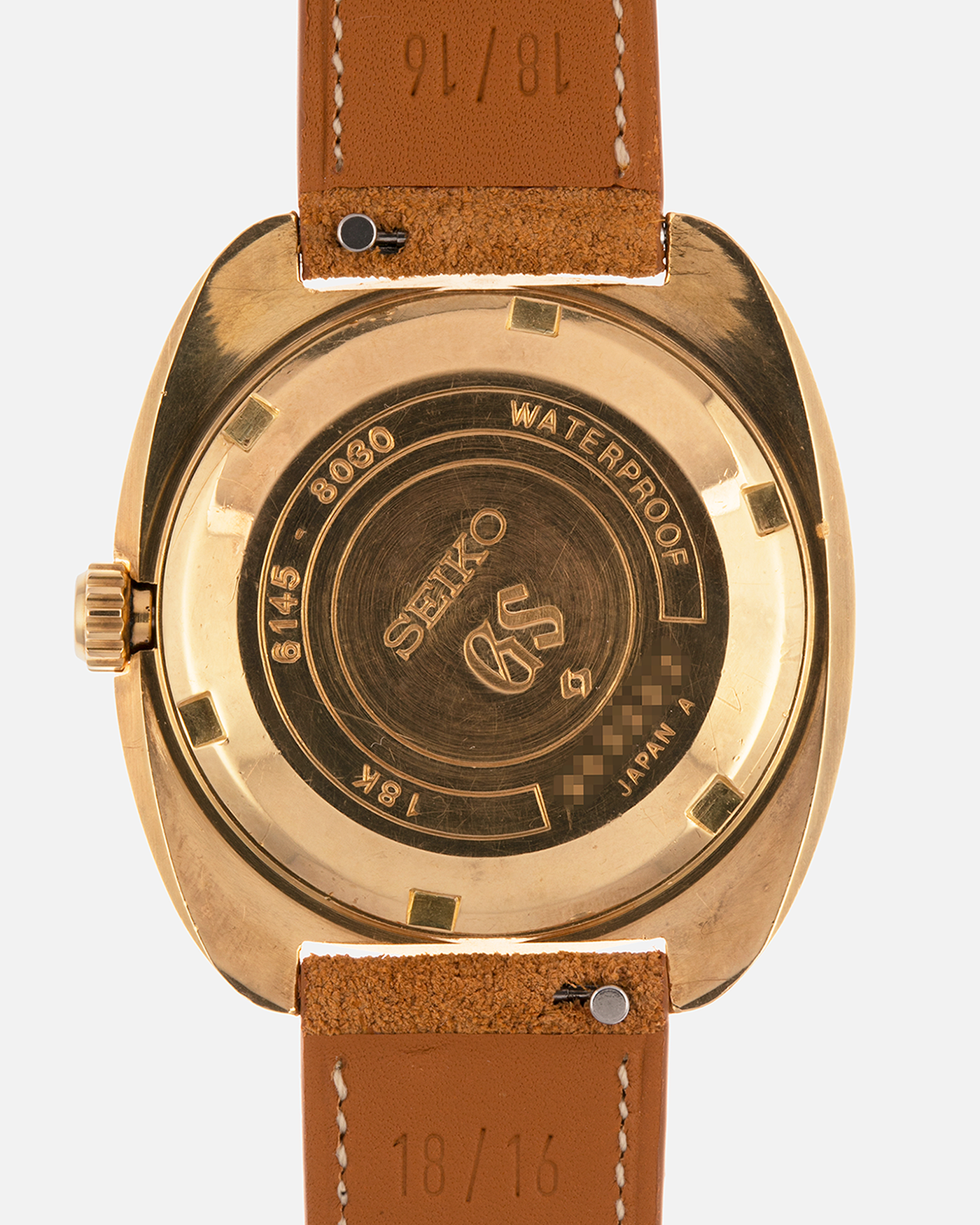 Brand: Grand Seiko
Year: Late 1960’s/1970’s
Model: 61GS
Reference Number: 6145-8030 ‘Kirazuri’
Material: 18-carat Yellow Gold
Movement: Self-Winding Hi Beat Cal. 6145
Case Dimensions: 37mm Diameter 11mm Thickness
Lug Width: 18mm
Strap: Nostime Tan Suede Strap with Generic Stainless Steel Buckle