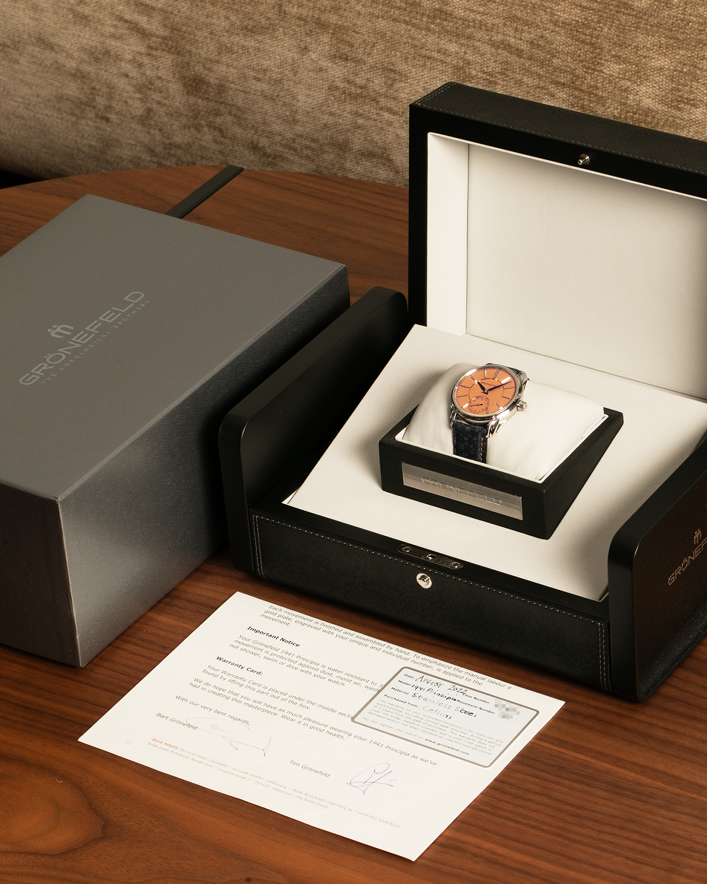 Brand: Grönefeld
Year: 2022
Model: 1941 Principia ‘Salmon’
Material: Stainless Steel
Movement: Grönefeld Cal. G-06, Self-Winding
Case Dimensions: 39.5mm x 10.5mm (Lug-to-Lug 47mm)
Lug Width: 20mm
Strap: Grönefeld Blue Buffalo Leather Strap with Orange Stitching, with Grönefeld Stainless Steel Tang Buckle