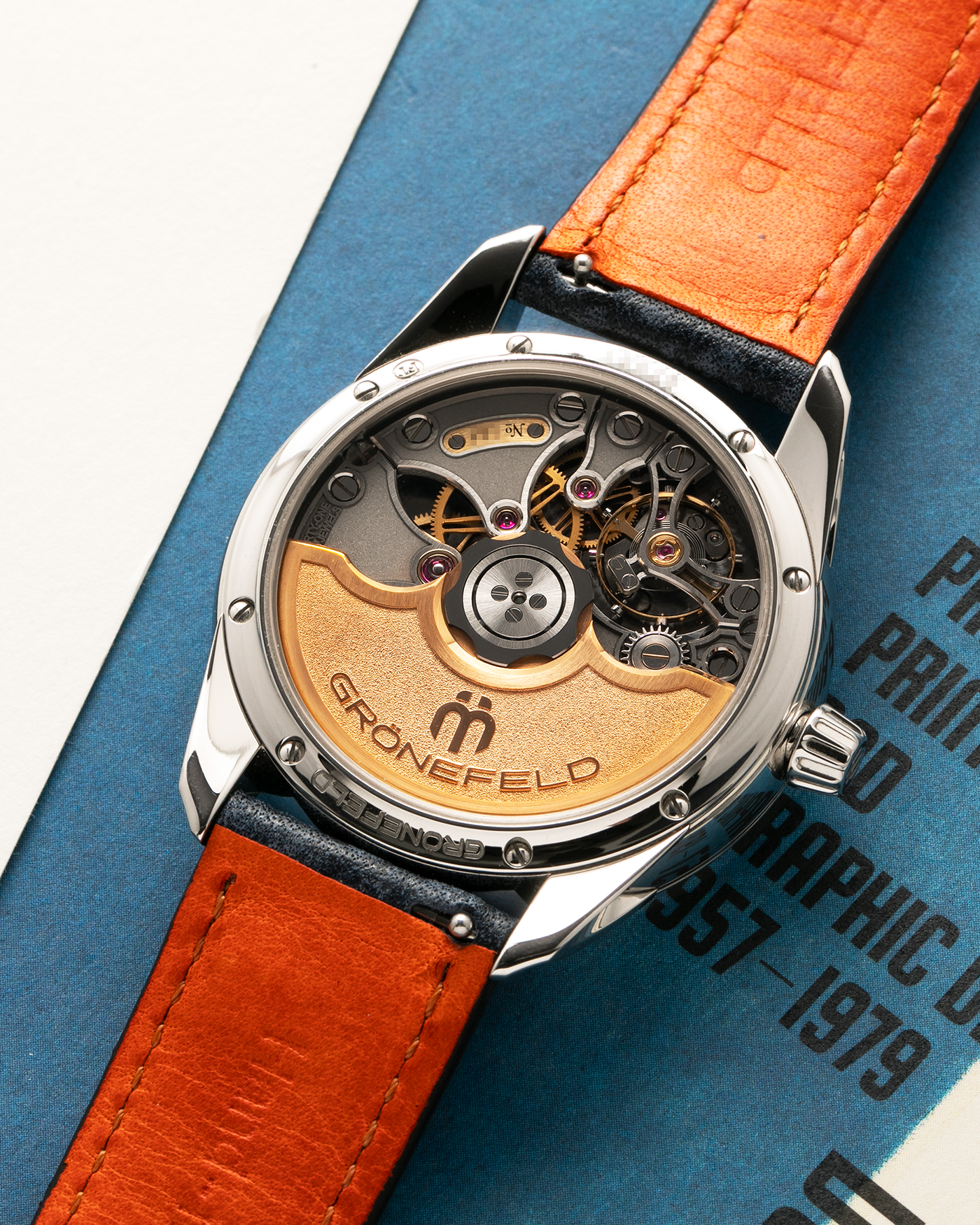Brand: Grönefeld
Year: 2022
Model: 1941 Principia ‘Salmon’
Material: Stainless Steel
Movement: Grönefeld Cal. G-06, Self-Winding
Case Dimensions: 39.5mm x 10.5mm (Lug-to-Lug 47mm)
Lug Width: 20mm
Strap: Grönefeld Blue Buffalo Leather Strap with Orange Stitching, with Grönefeld Stainless Steel Tang Buckle