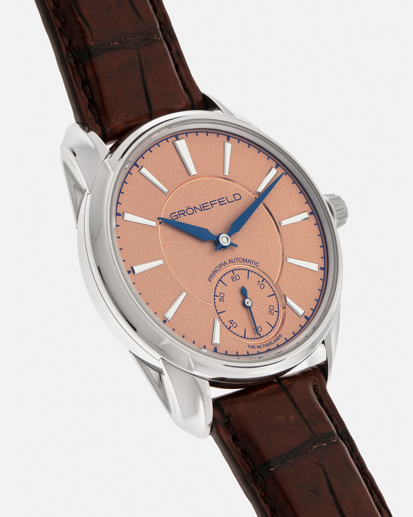 Brand: Grönefeld
Year: 2022
Model: 1941 Principia ‘Salmon’
Material: Stainless Steel
Movement: Grönefeld Cal. G-06, Self-Winding
Case Dimensions: 39.5mm x 10.5mm (Lug-to-Lug 47mm)
Lug Width: 20mm
Strap: Grönefeld Brown Alligator Leather Strap with Signed Stainless Steel Tang Buckle