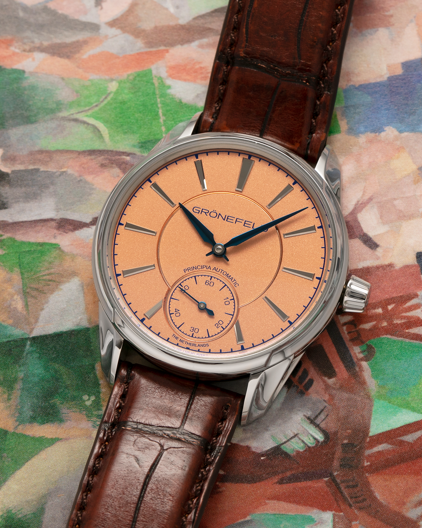 Brand: Grönefeld
Year: 2022
Model: 1941 Principia ‘Salmon’
Material: Stainless Steel
Movement: Grönefeld Cal. G-06, Self-Winding
Case Dimensions: 39.5mm x 10.5mm (Lug-to-Lug 47mm)
Lug Width: 20mm
Strap: Grönefeld Brown Alligator Leather Strap with Signed Stainless Steel Tang Buckle