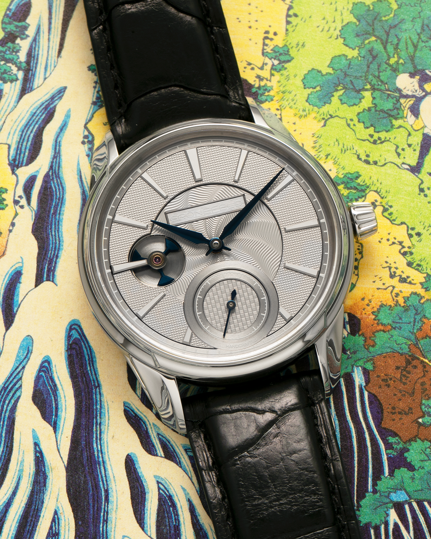 Brand: Grönefeld
Year: 2022
Model: 1941 Remontoire ‘Guilloché’, Pièce Unique
Material: Stainless Steel
Movement: Grönefeld Cal. G-05, Manual-Winding
Case Dimensions: 39.5mm x 10.5mm (Lug-to-Lug 47mm)
Lug Width: 20mm
Strap: Grönefeld Black Calf Leather Strap with Signed Stainless Steel Tang Buckle