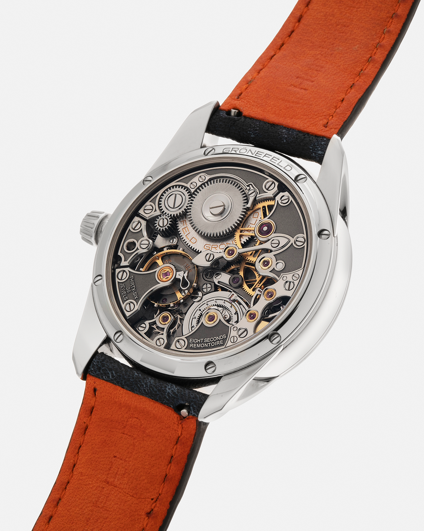 Brand: Grönefeld Year: XXXX Model: 1941 Remontoire ‘Salmon’ Material: Stainless Steel Movement: Grönefeld Cal. G-05, Manual-Winding Case Dimensions: 39.5mm x  10.5mm Lug Width: 20mm Strap: Grönefeld Blue Ostrich / Dutch Orange Leather Strap with Signed Stainless Steel 916L Tang Buckle