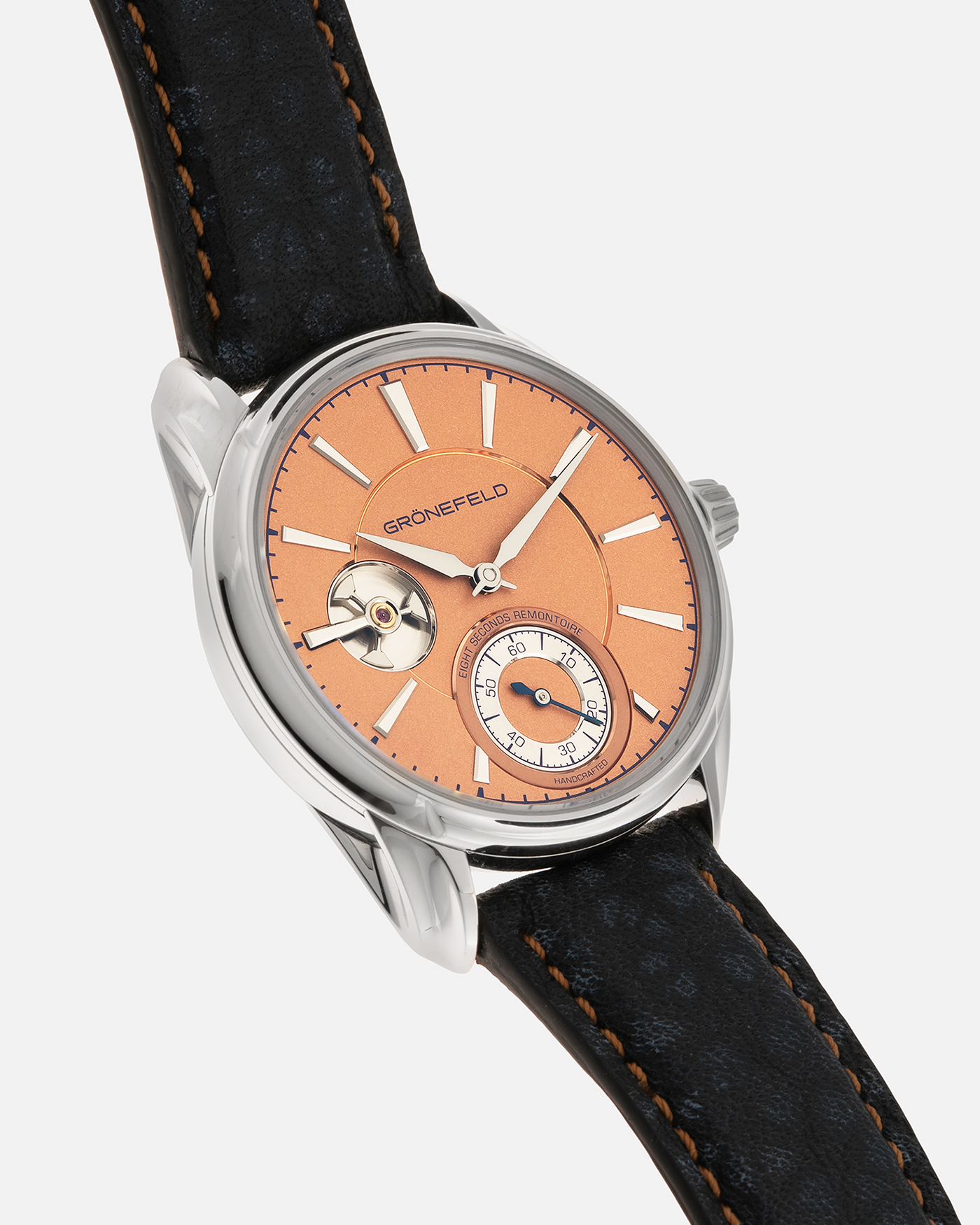 Brand: Grönefeld Year: XXXX Model: 1941 Remontoire ‘Salmon’ Material: Stainless Steel Movement: Grönefeld Cal. G-05, Manual-Winding Case Dimensions: 39.5mm x  10.5mm Lug Width: 20mm Strap: Grönefeld Blue Ostrich / Dutch Orange Leather Strap with Signed Stainless Steel 916L Tang Buckle